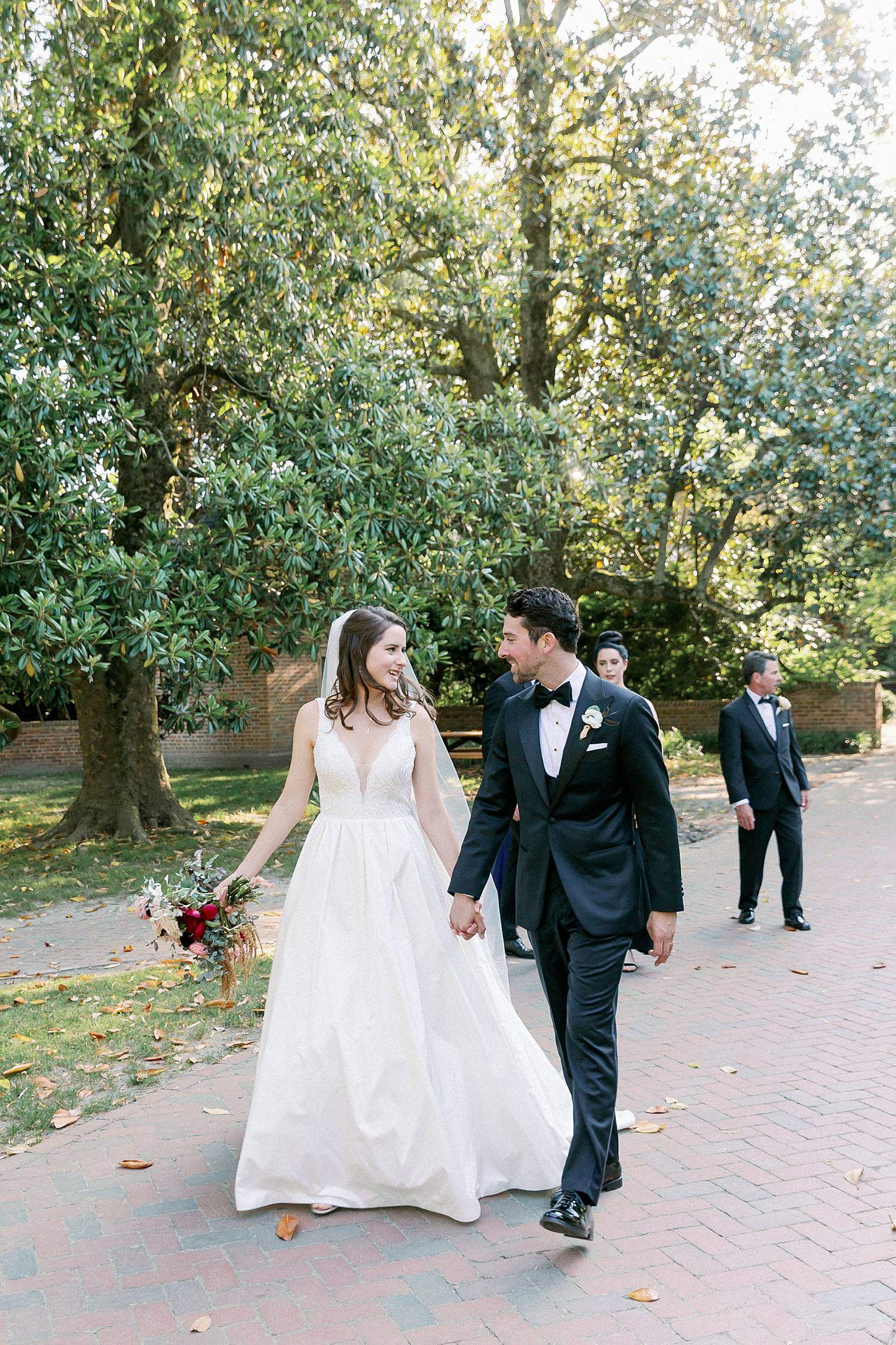 Bride and groom walking together at The Williamsburg Inn