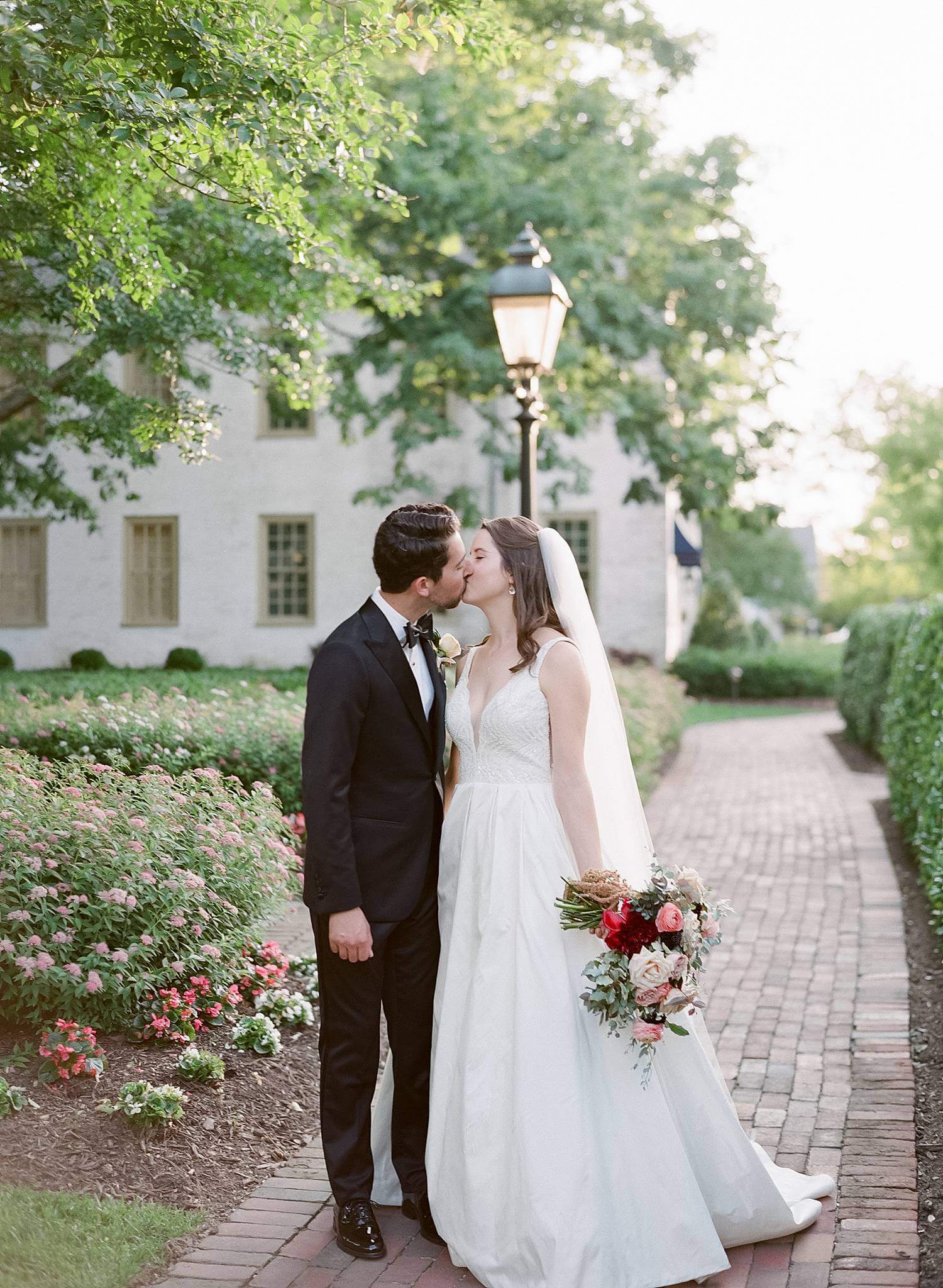 Bride and groom kissing at The Williamsburg Inn
