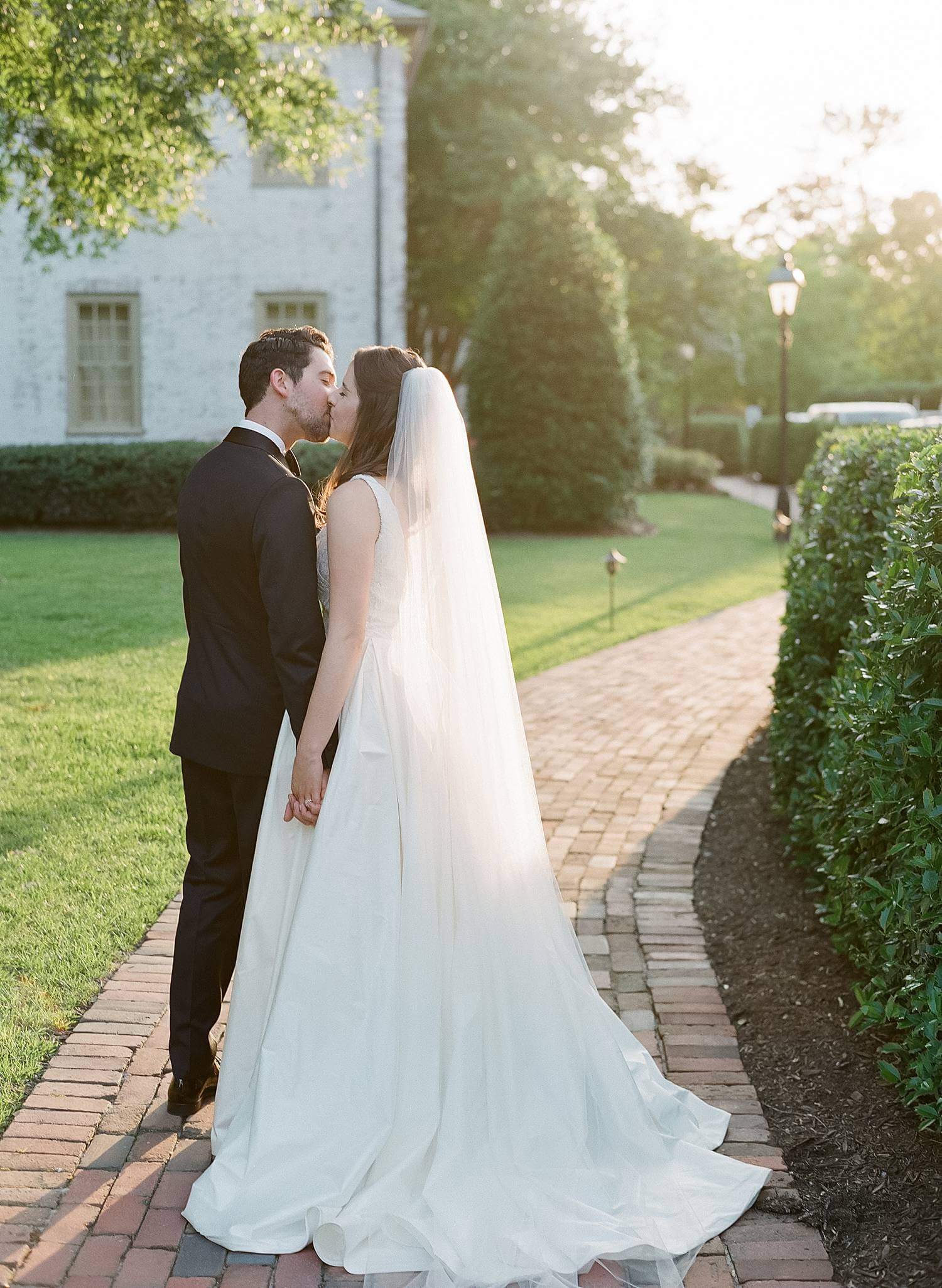 Bride and groom kissing at The Williamsburg Inn