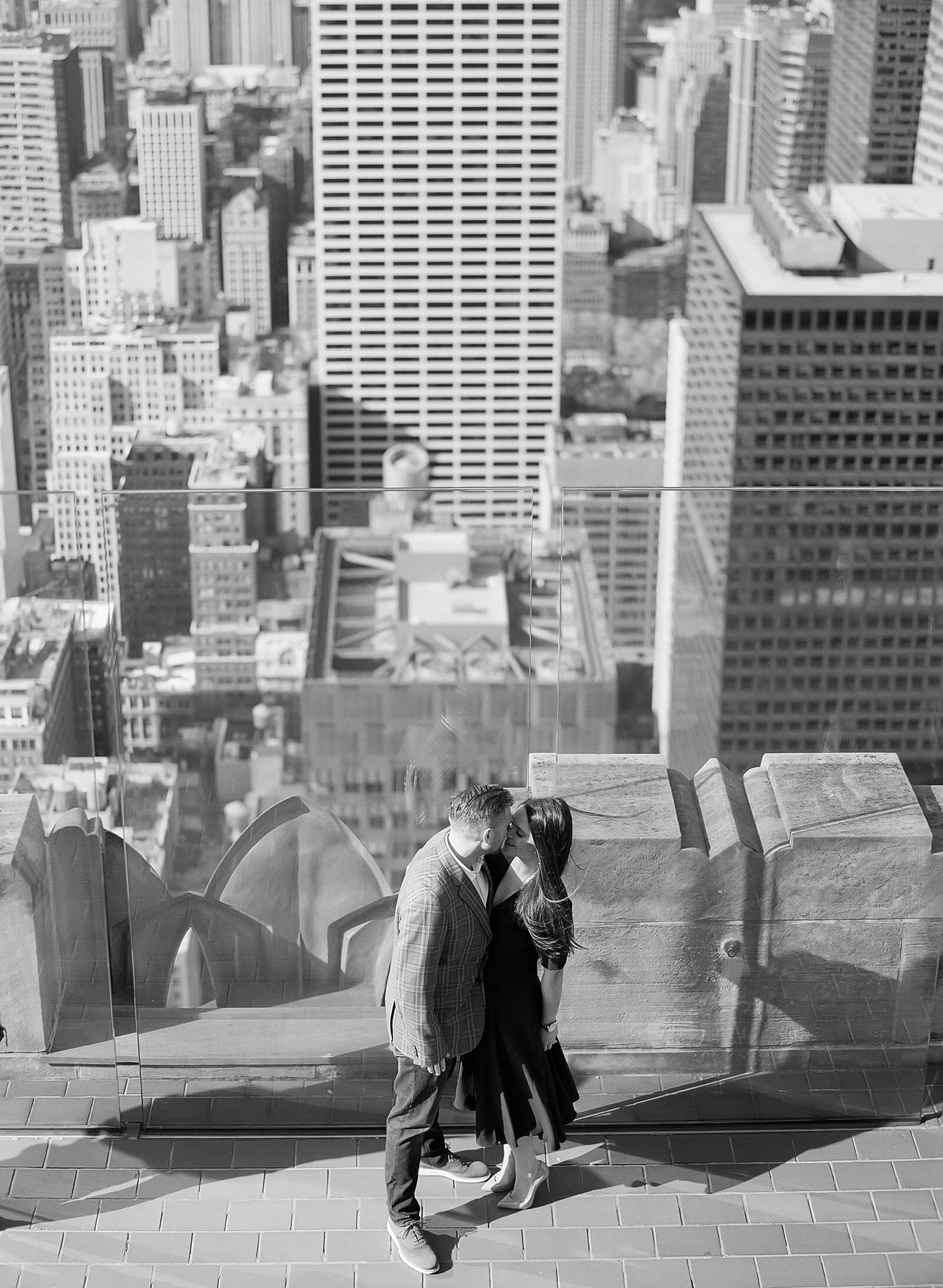 A couple during their engagement session at The Top of The Rock.