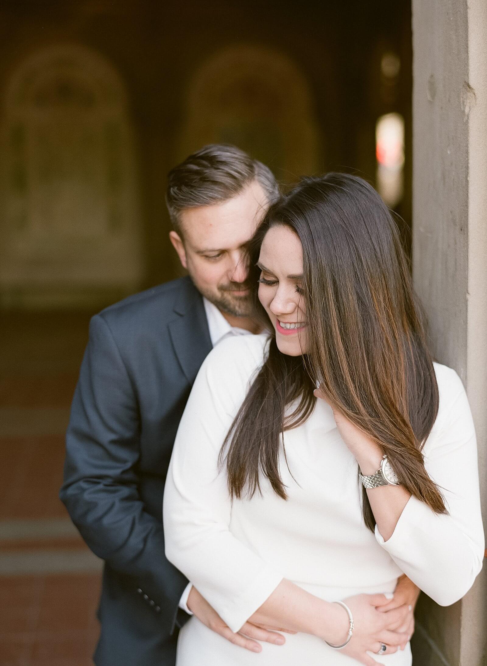 A couple during their engagement session at Bethesda Terrace in Central Park.