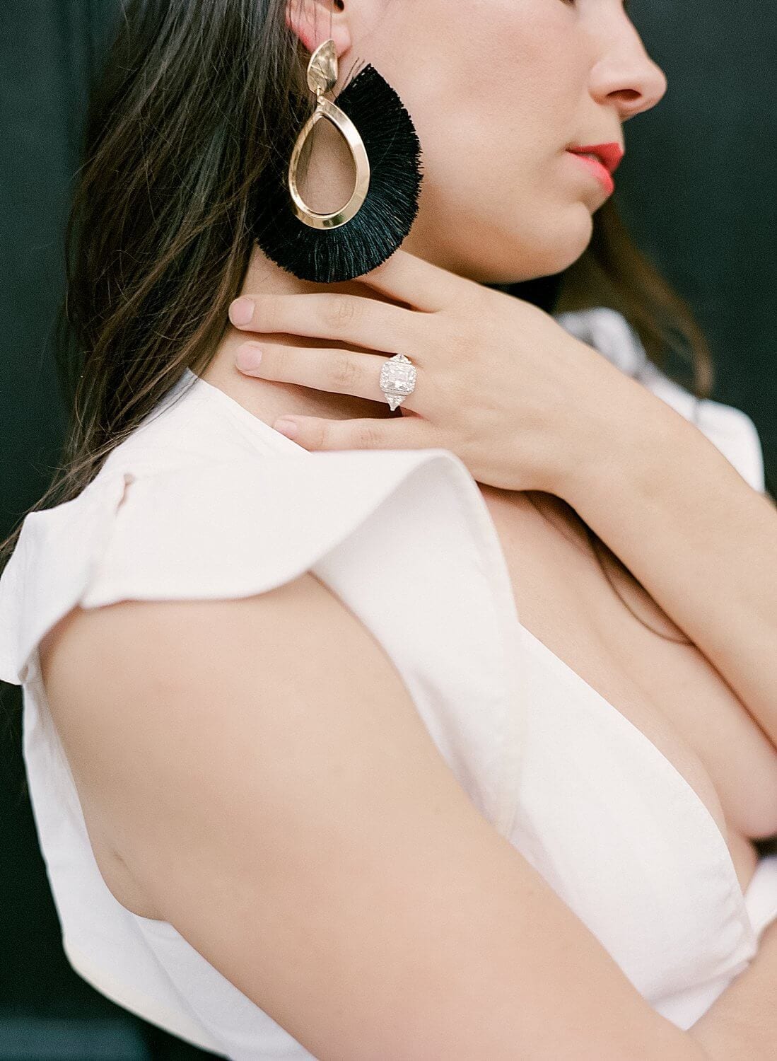 model showing off earrings and ring for an editorial shoot