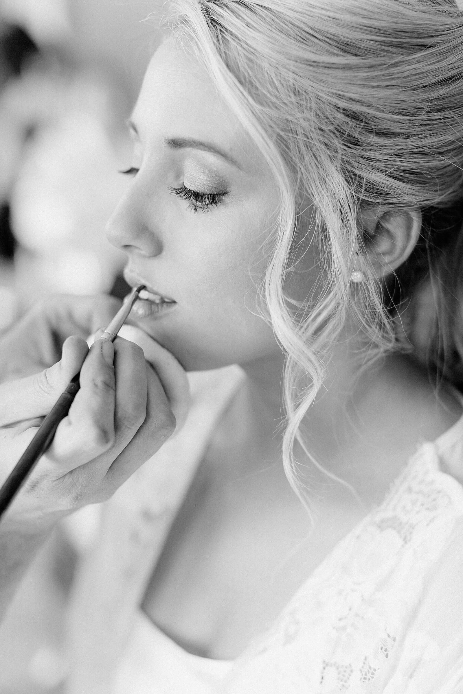 Bride getting make up at Trump winery during her wedding