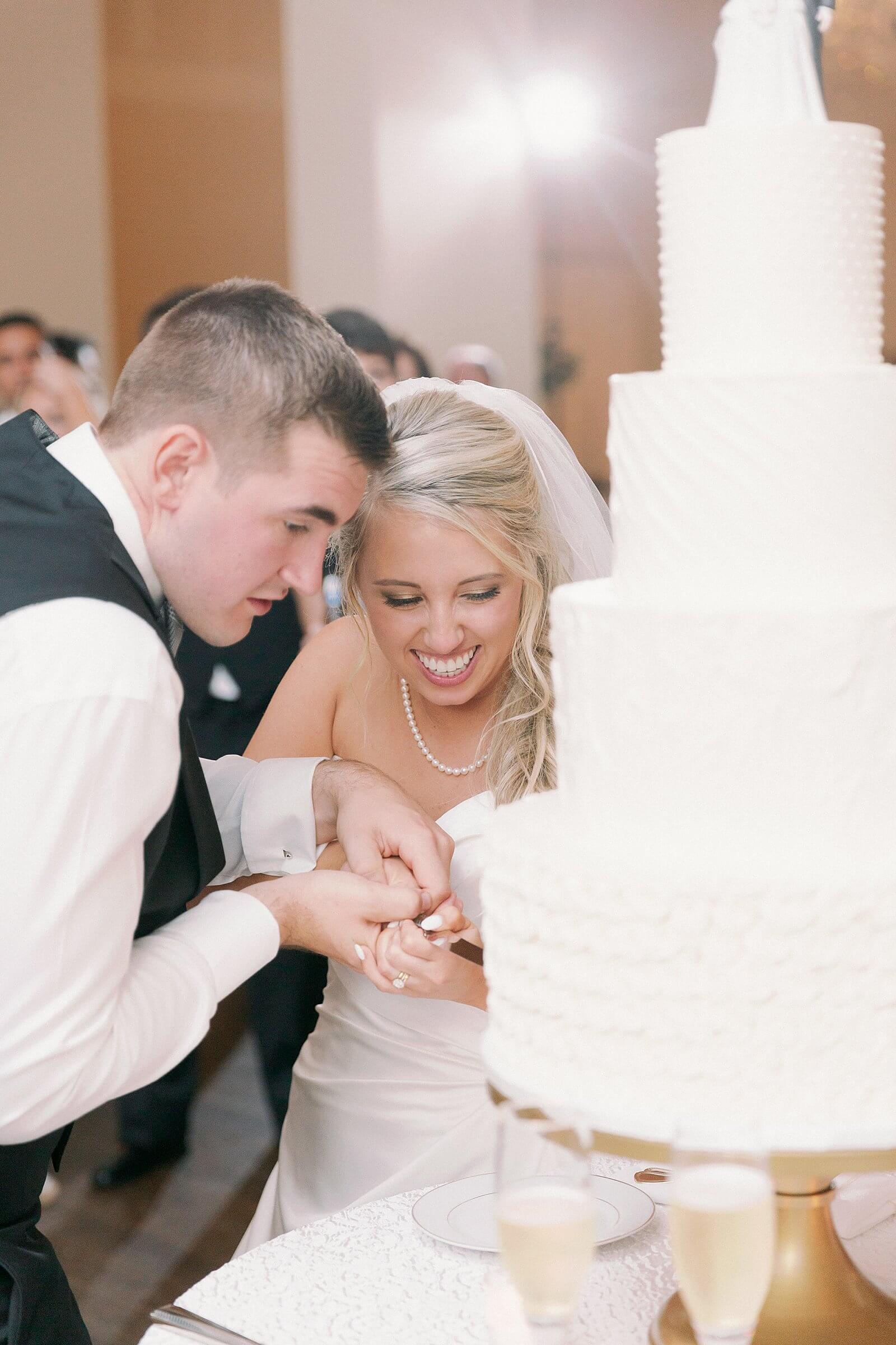 Cake cutting at a wedding at Trump Winery Grand Hall
