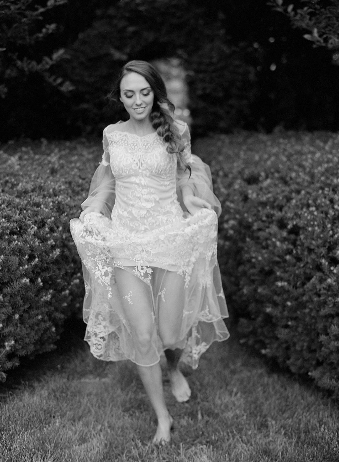 Bride running barefoot in designer Claire Pettibone gown at Waterperry Farm Wedding