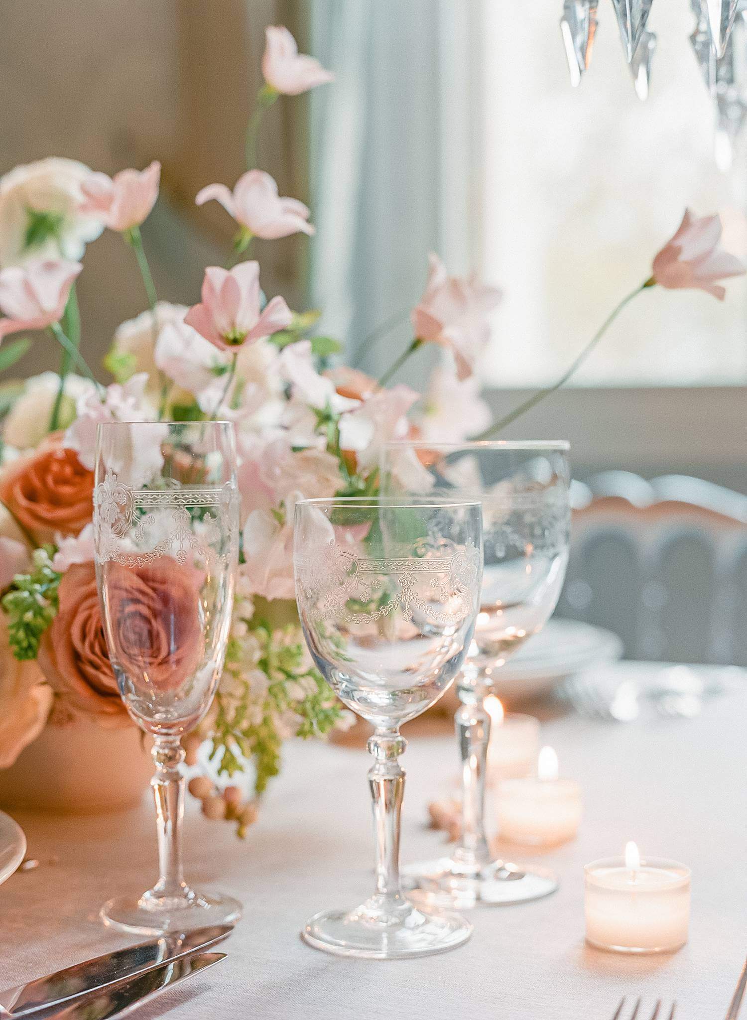 Table details of crystal wine glasses at reception for an elopement at Chateau Couffins in Bordeaux France