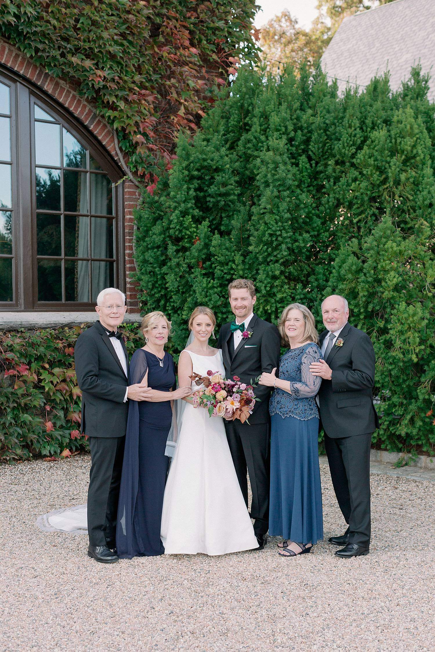 Family portrait for bride and her family during a wedding at Dover Hall Estate.