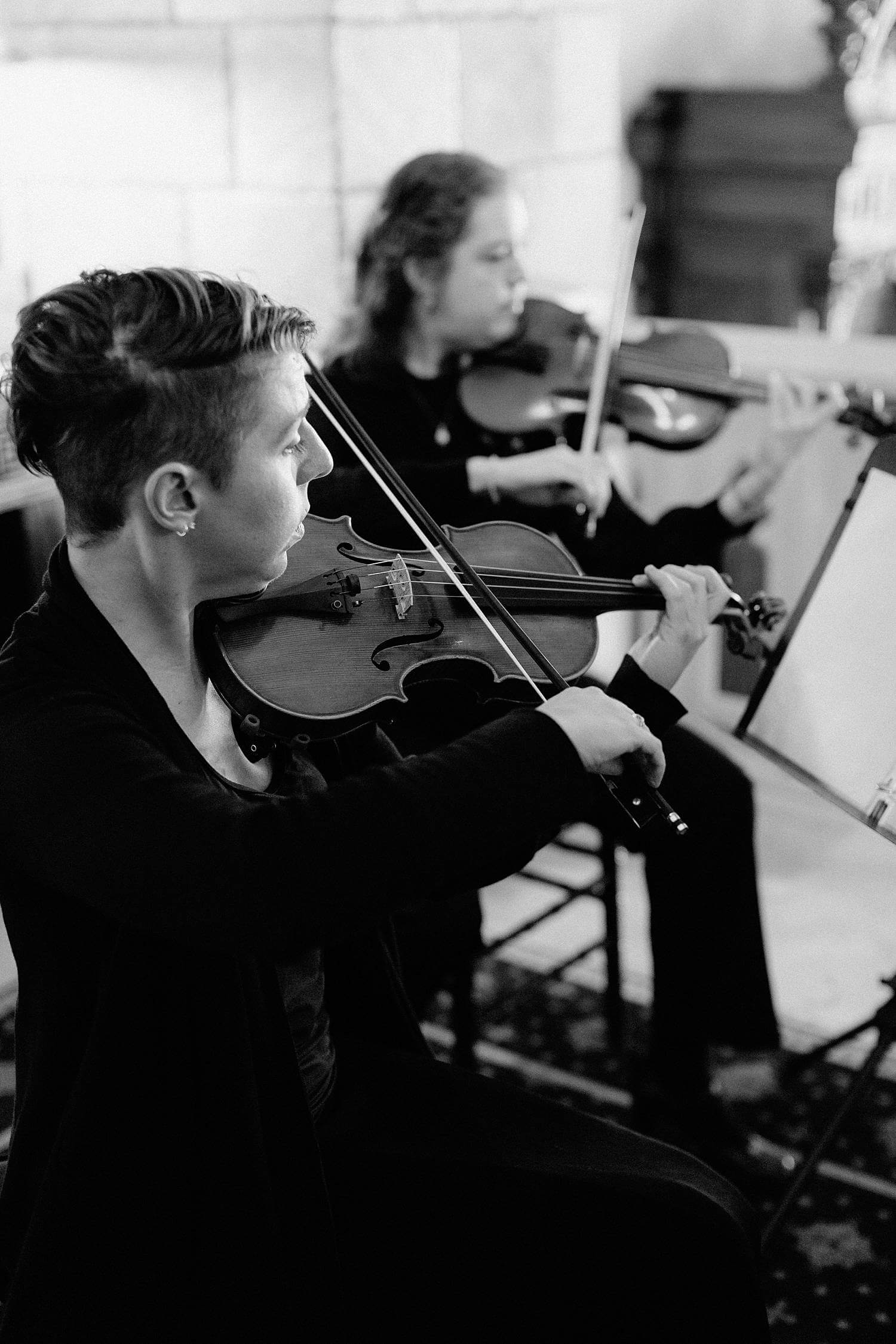 Violins playing during ceremony at Dover Hall Estate