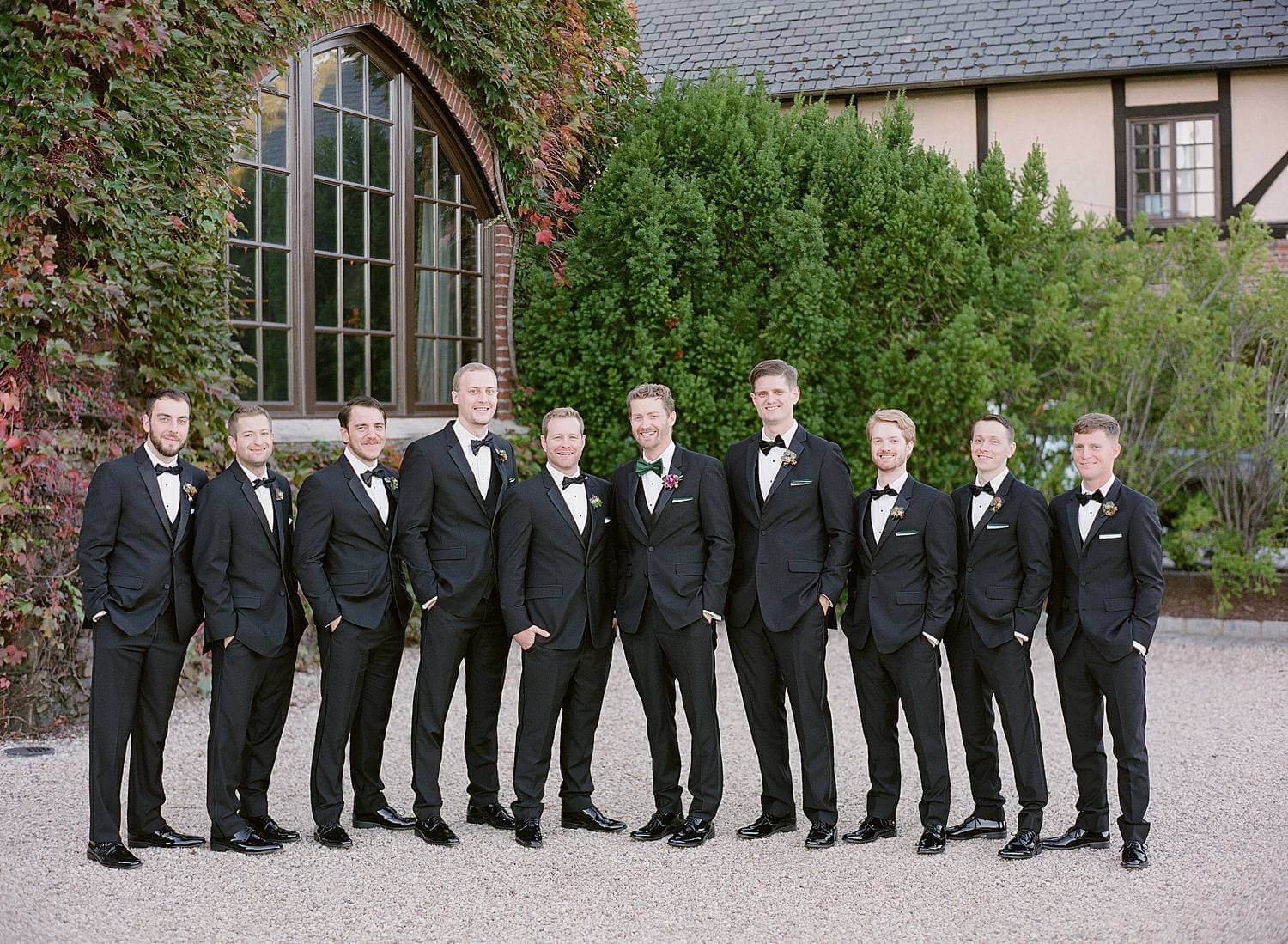 Groomsmen standing for photos at Dover Hall Estate