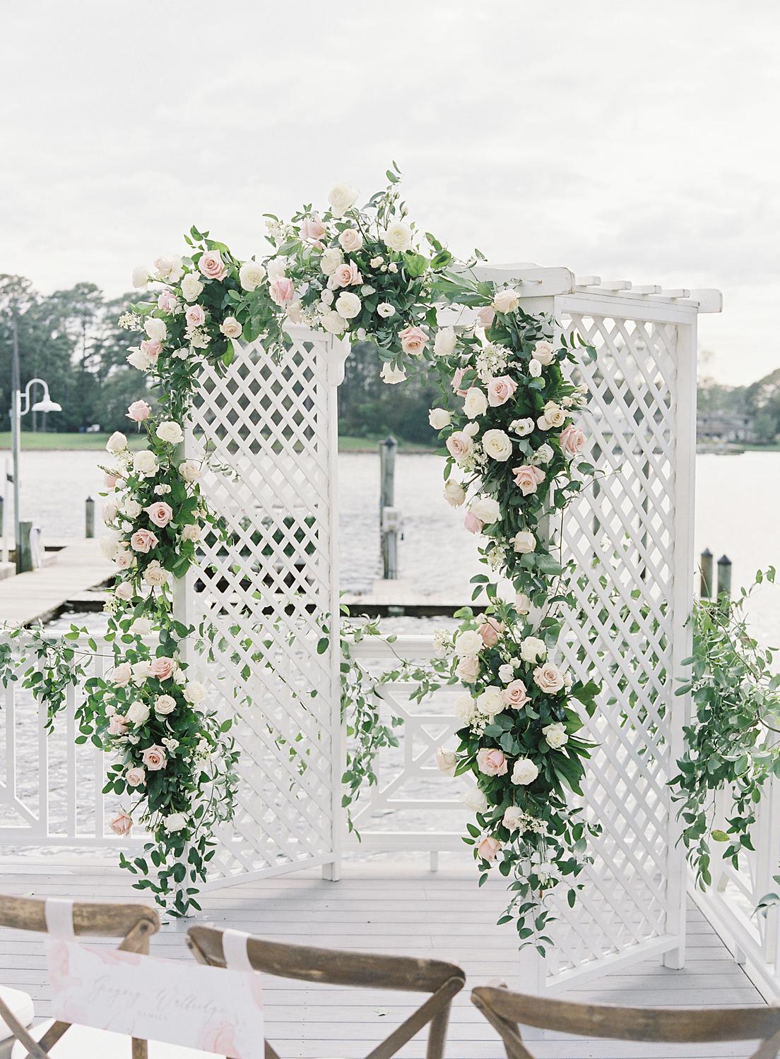 Ivy and rose covered pergola for intimate home wedding