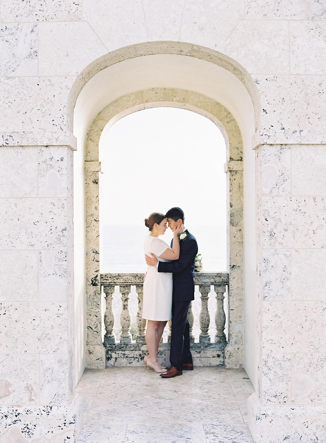 Bride and groom embracing during their elopement in Palm Beach