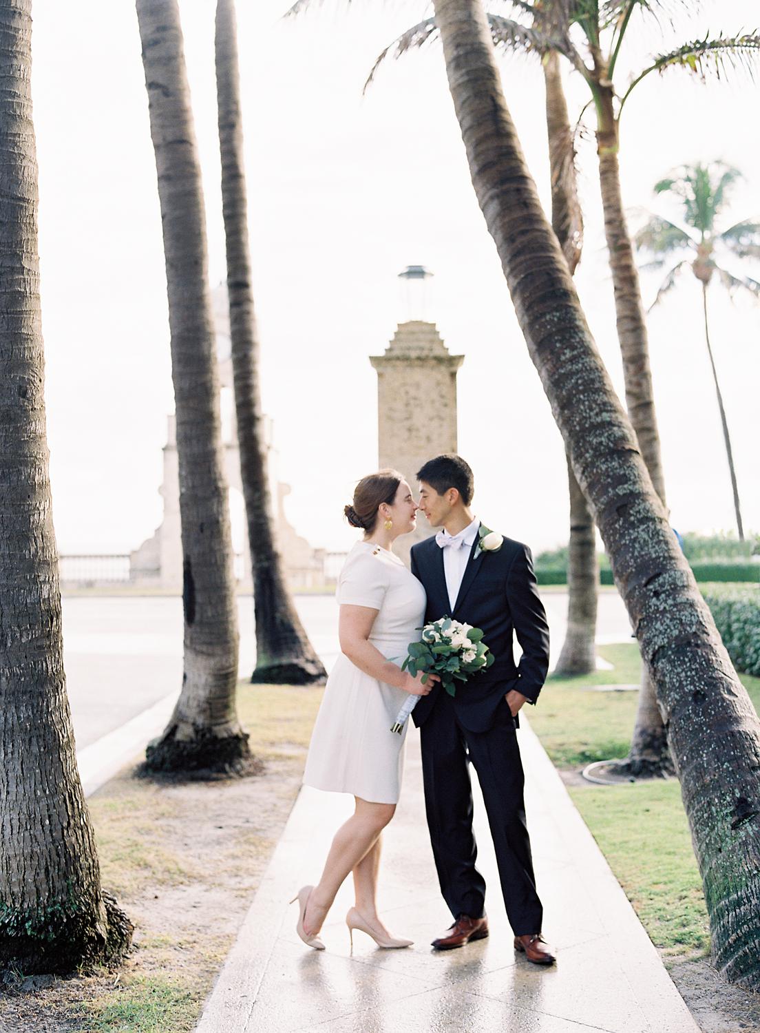 Bride and groom kissing on Worth Avenue during their Palm Beach Elopment.