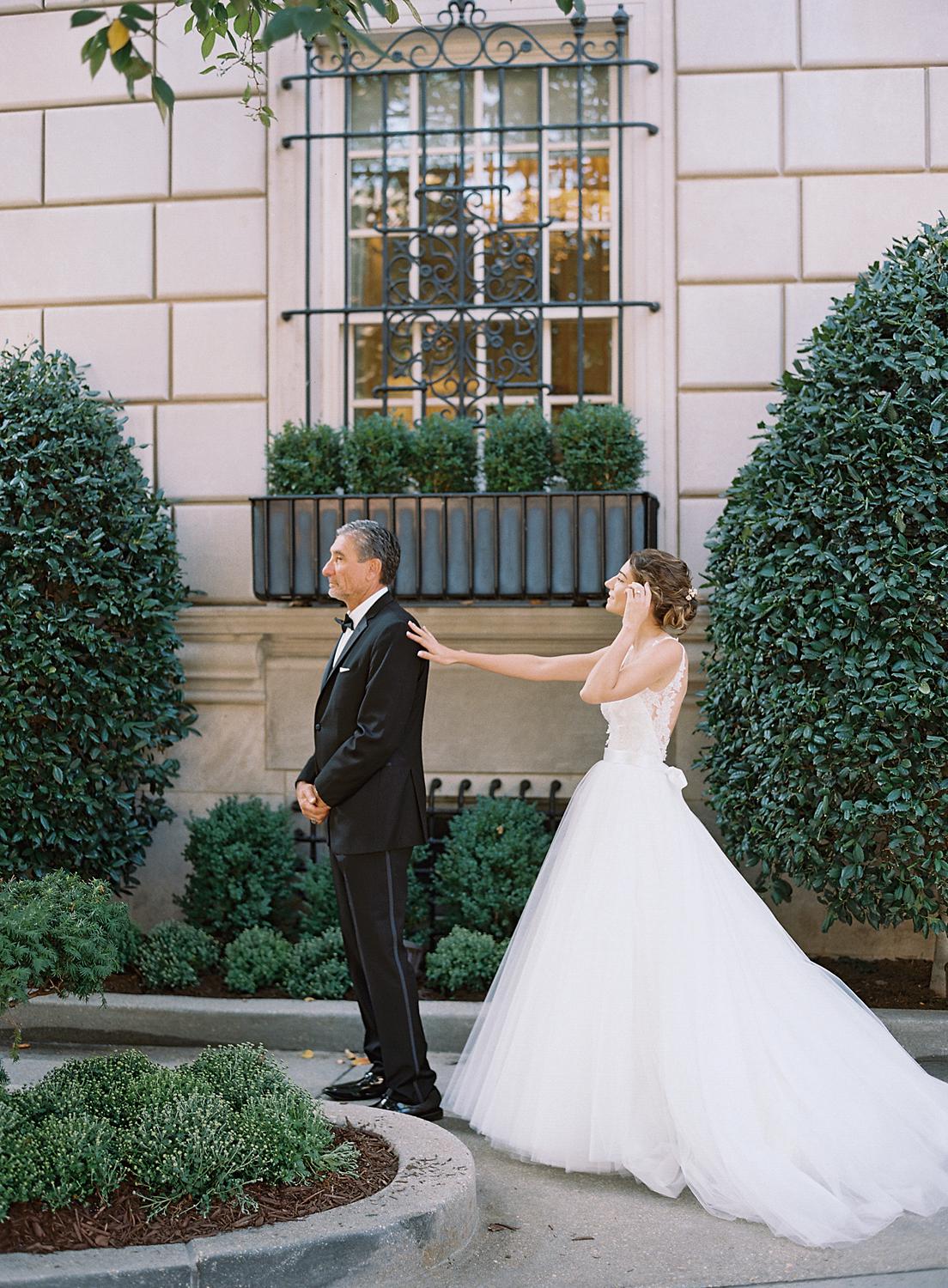 Bride having a first look with her dad before her wedding at DAR Constitution Hall