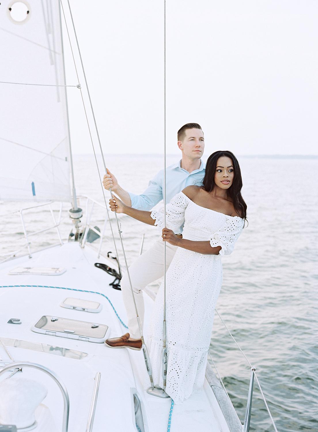 Bride and groom looking out over the water during Annapolis engagement session.