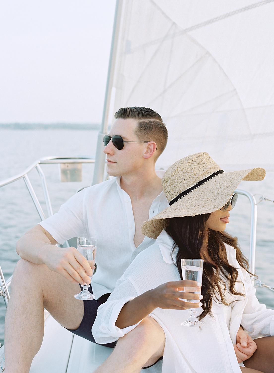 Couple sharing a drink together during their Annapolis Harbor engagement session.