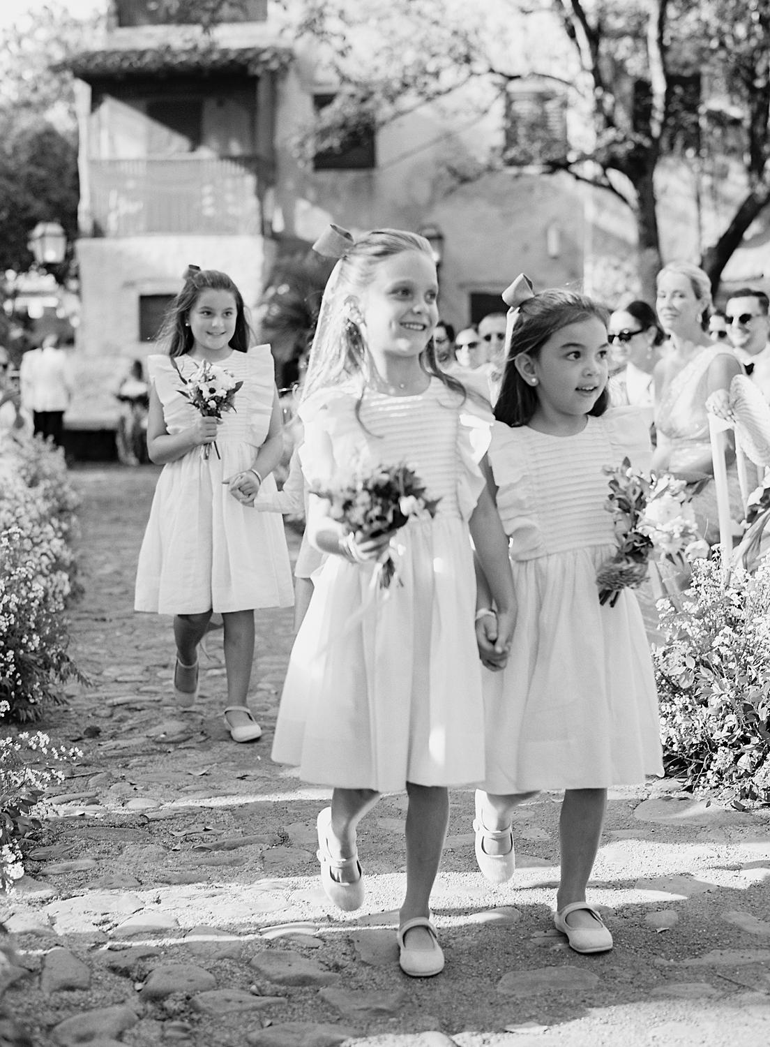 Flower-girls walking into Altos de Chavón wedding.
