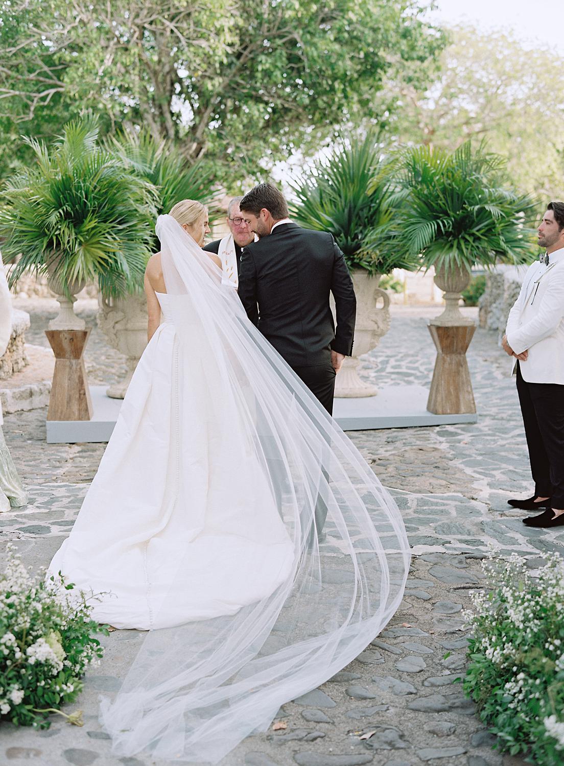 Brides veil as it is caught by the wind at their Altos de Chavón wedding.