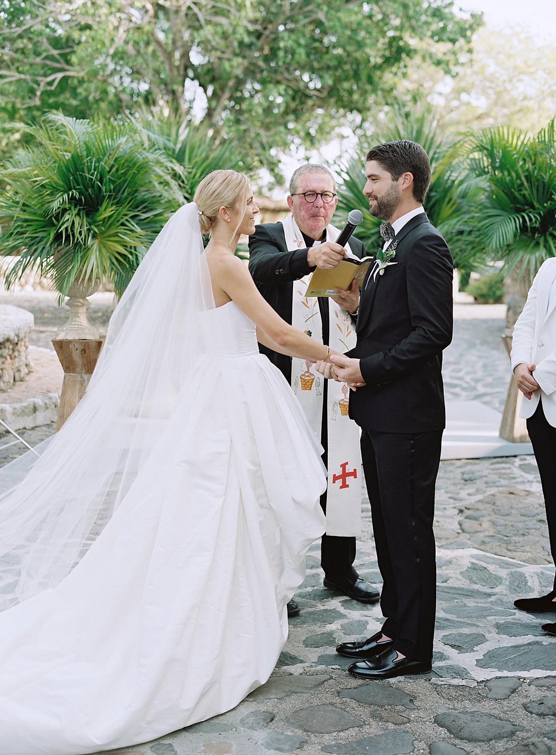 Bride and groom exchanging their vows during their Altos de Chavón wedding.