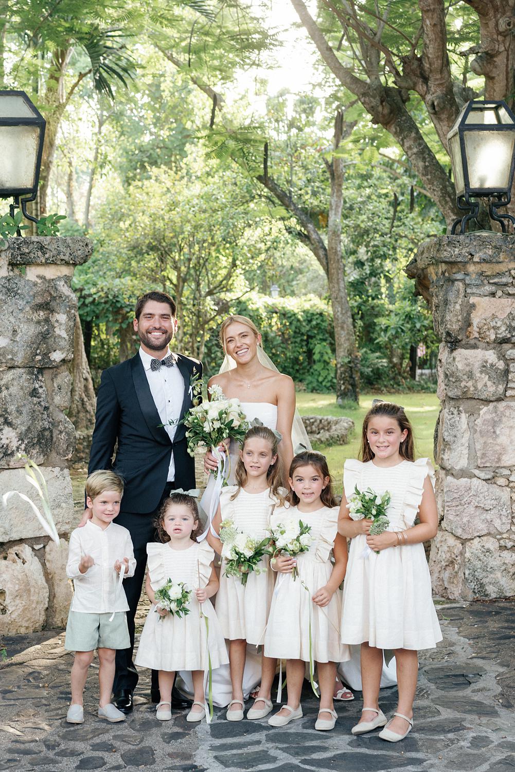 Bride and groom with flower girls and ring bearer at Altos de Chavón wedding.