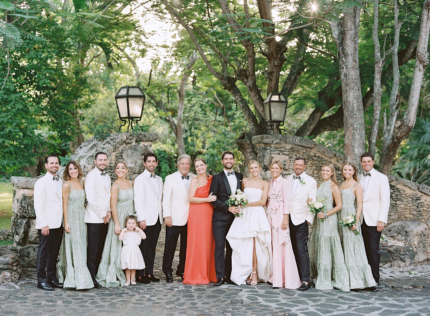Bride and groom with family for portrait at Altos de Chavón wedding.