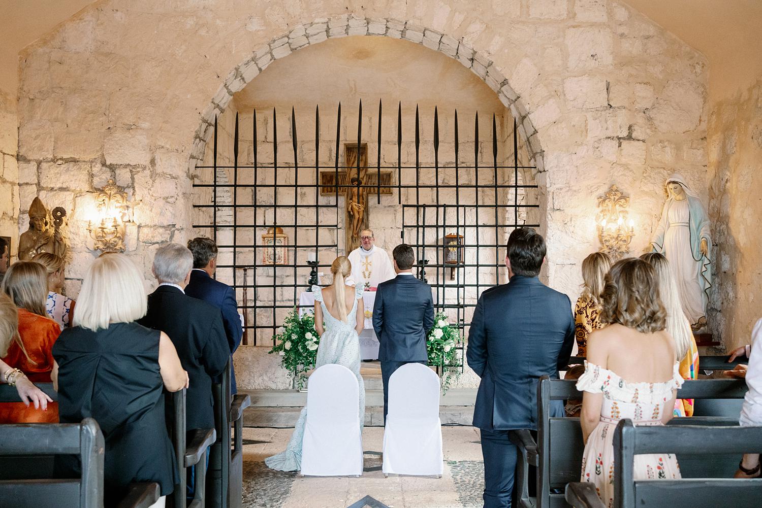 Bride and groom standing together during private family ceremony at Altos De Chavon.
