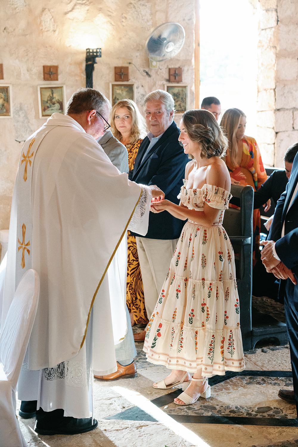 Communion during private family ceremony at Altos De Chavon