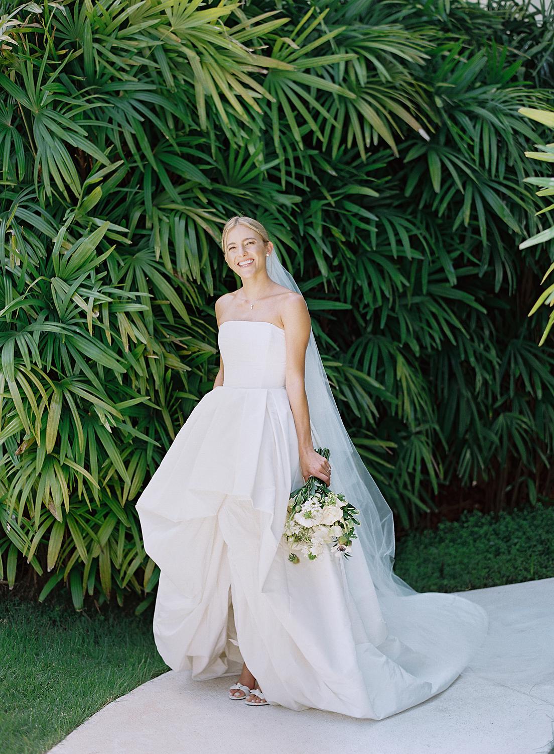 Portrait of bride against the lush greenery of The Dominican Republic.