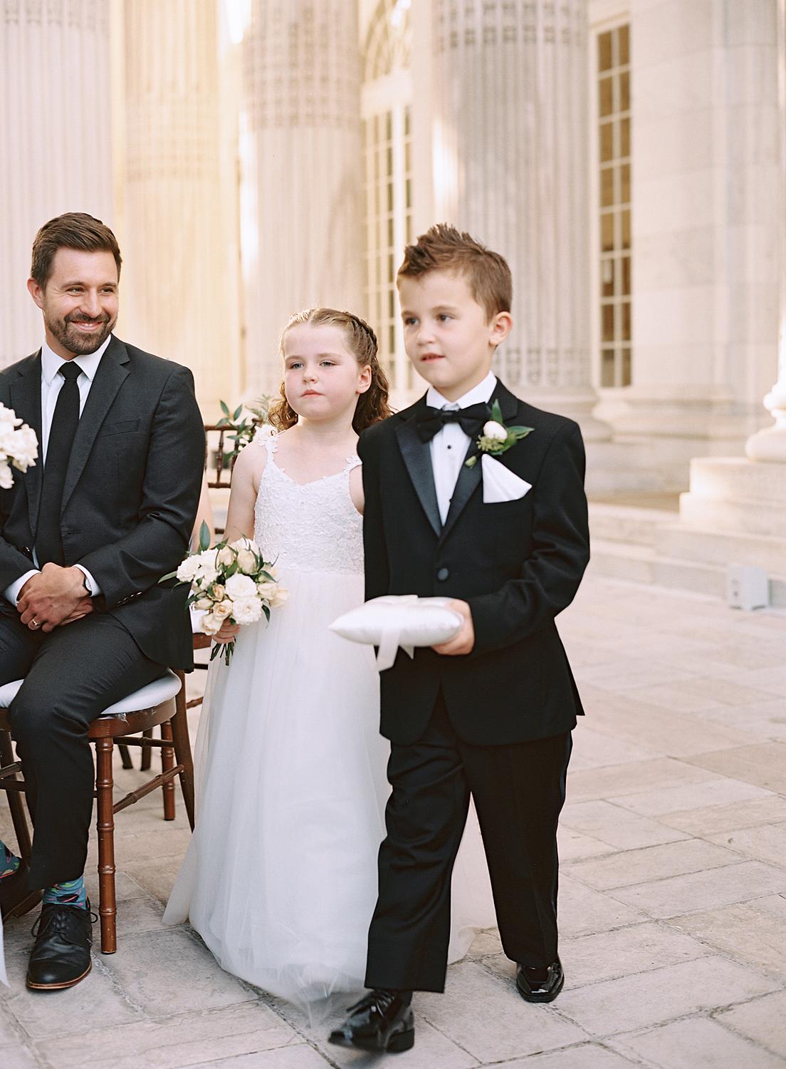 Flower girl and ring bearer bringing in the wedding bands for the ceremony at DAR Constitution Hall.