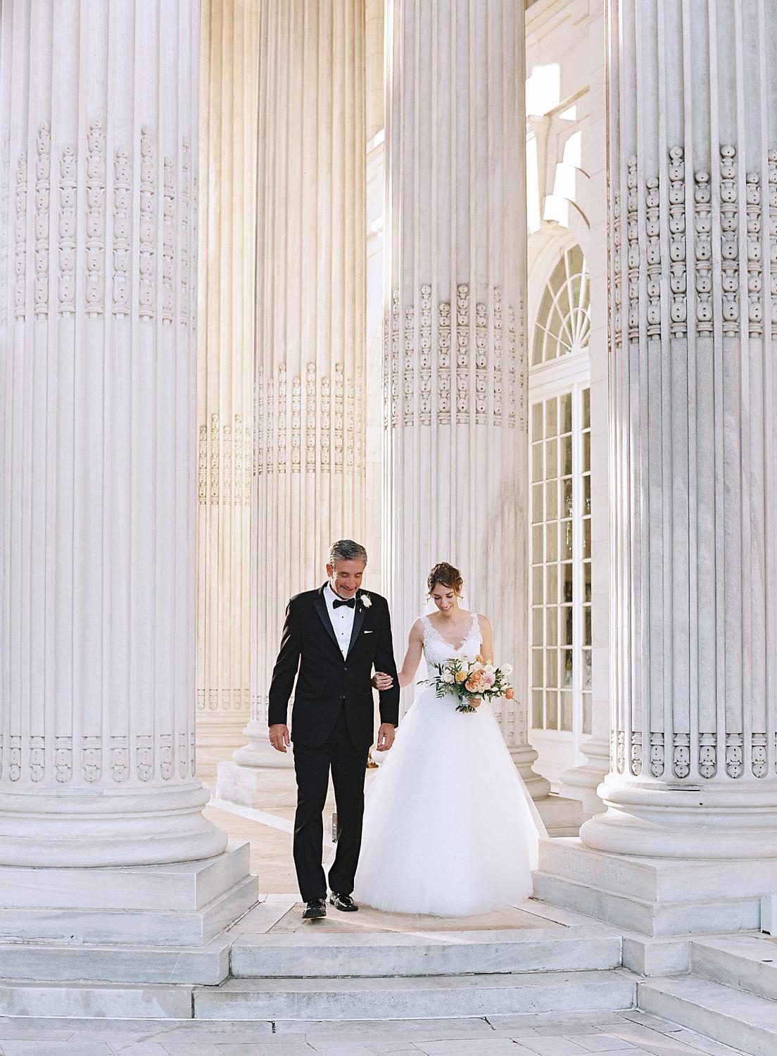 Bride walking into her ceremony at DAR Constitution Hall wedding.