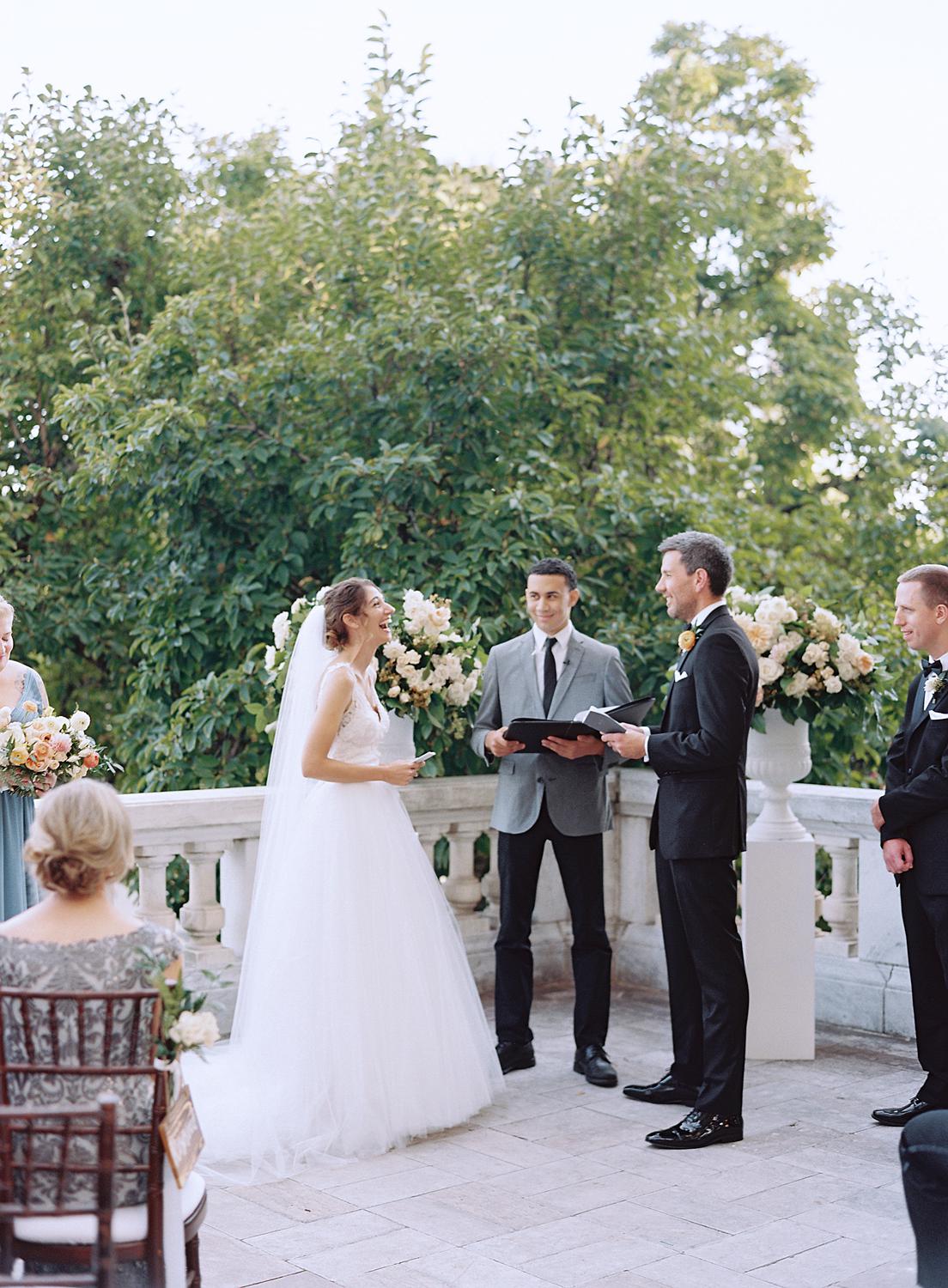 Bride and groom saying their vows at their DAR Constitution Hall wedding.