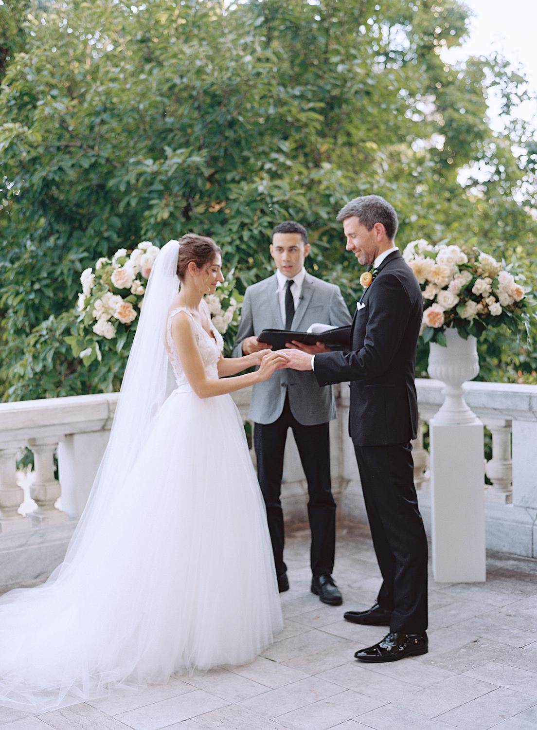 Bride and groom saying their vows at their DAR Constitution Hall wedding.