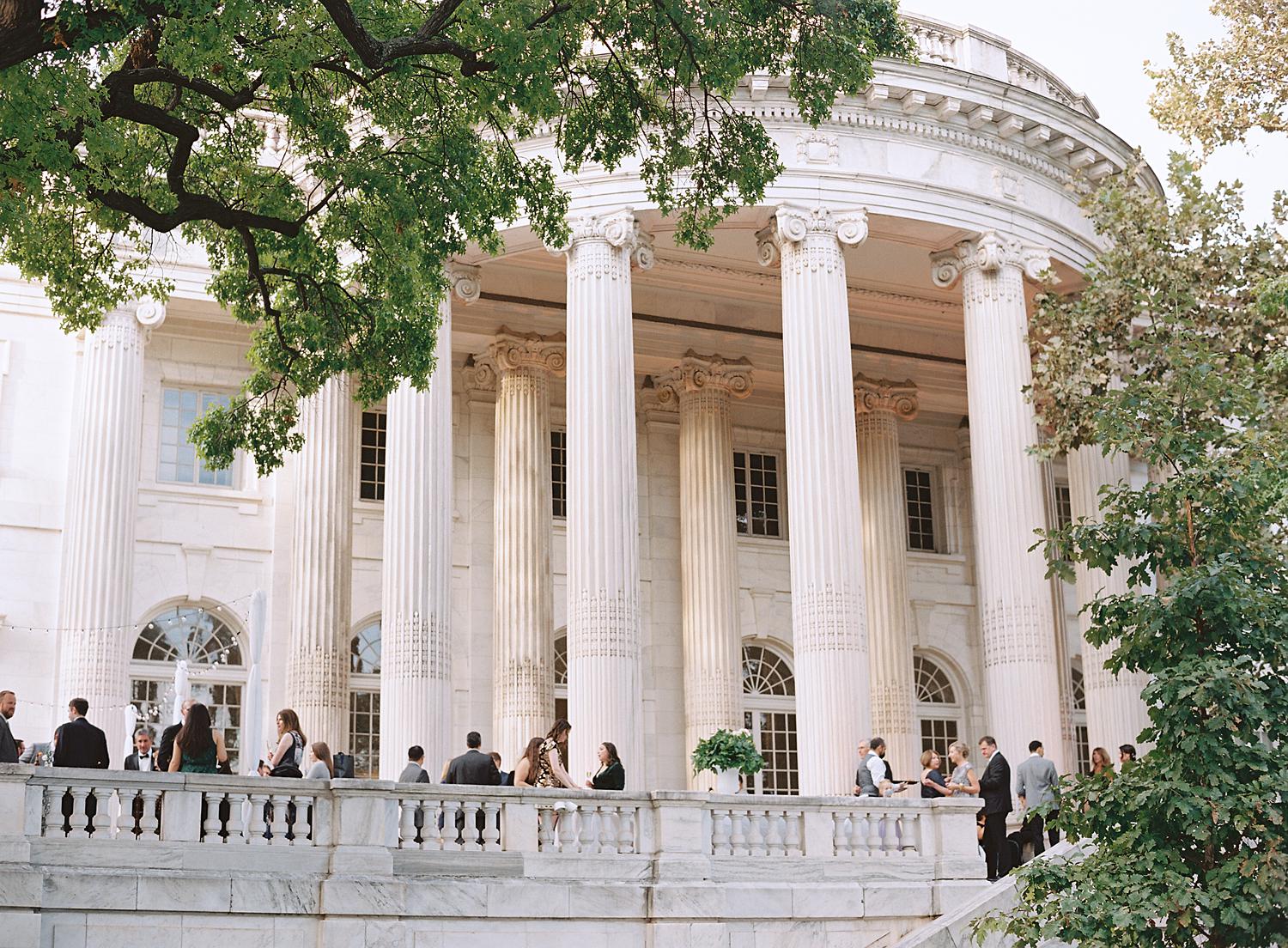 Guests enjoying cocktail hour on the outdoor patio of DAR Constitution Hall.