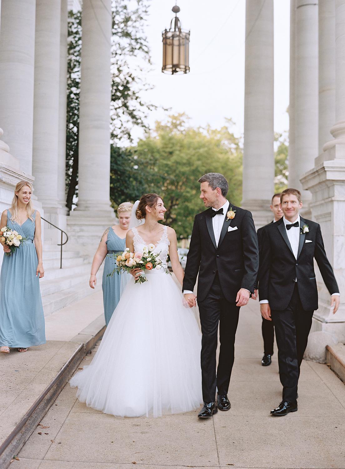 Bridal party walking together after portraits at DAR Constitution Hall wedding.