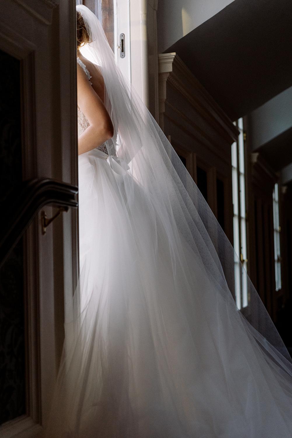 image of bride as she walks out to the rooftop balcony of DAR Constitution hall.