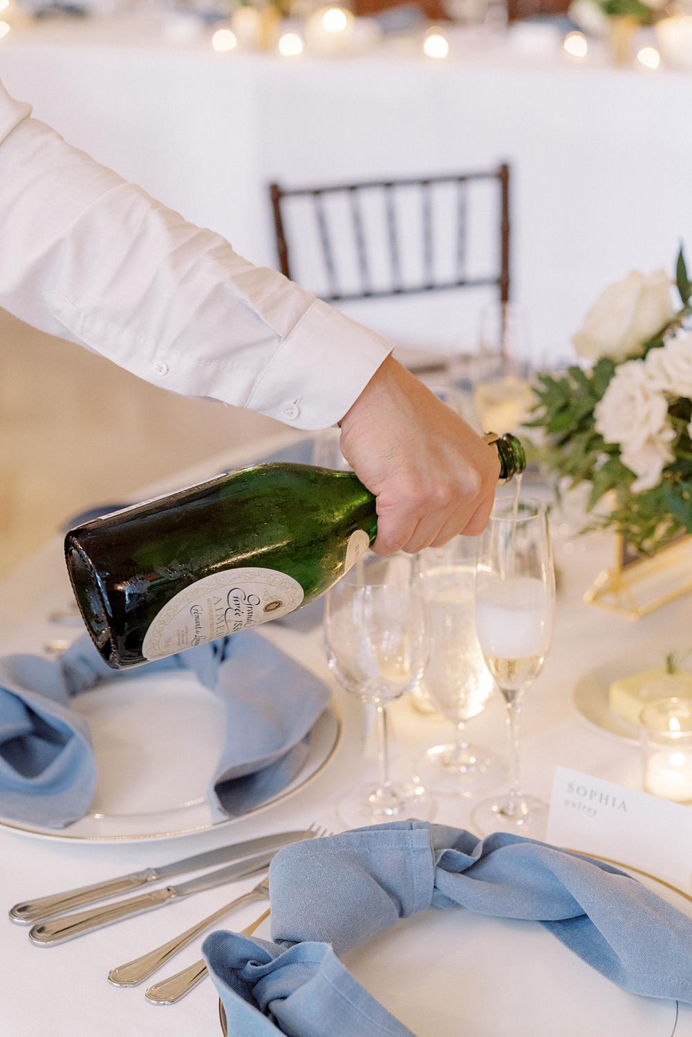 Waiter pouring champagne for the wedding reception at DAR Constitution Hall.