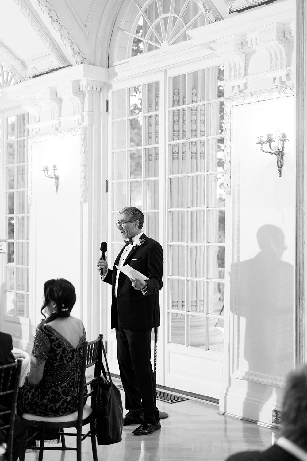 Father of the bride giving a speech at a DAR Constitution Hall wedding.