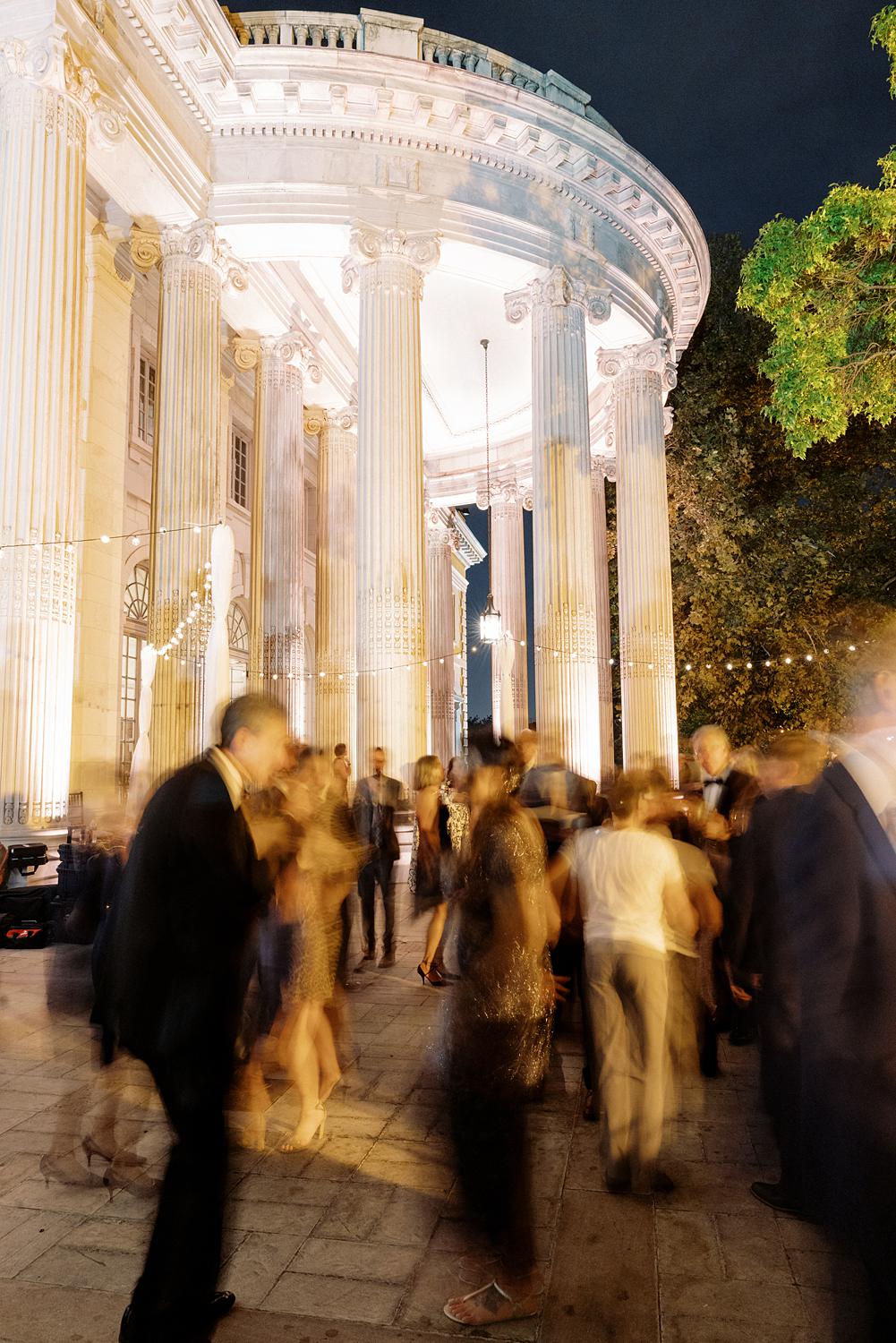 Guests dancing outside on the patio at a DAR Constitution Hall wedding.