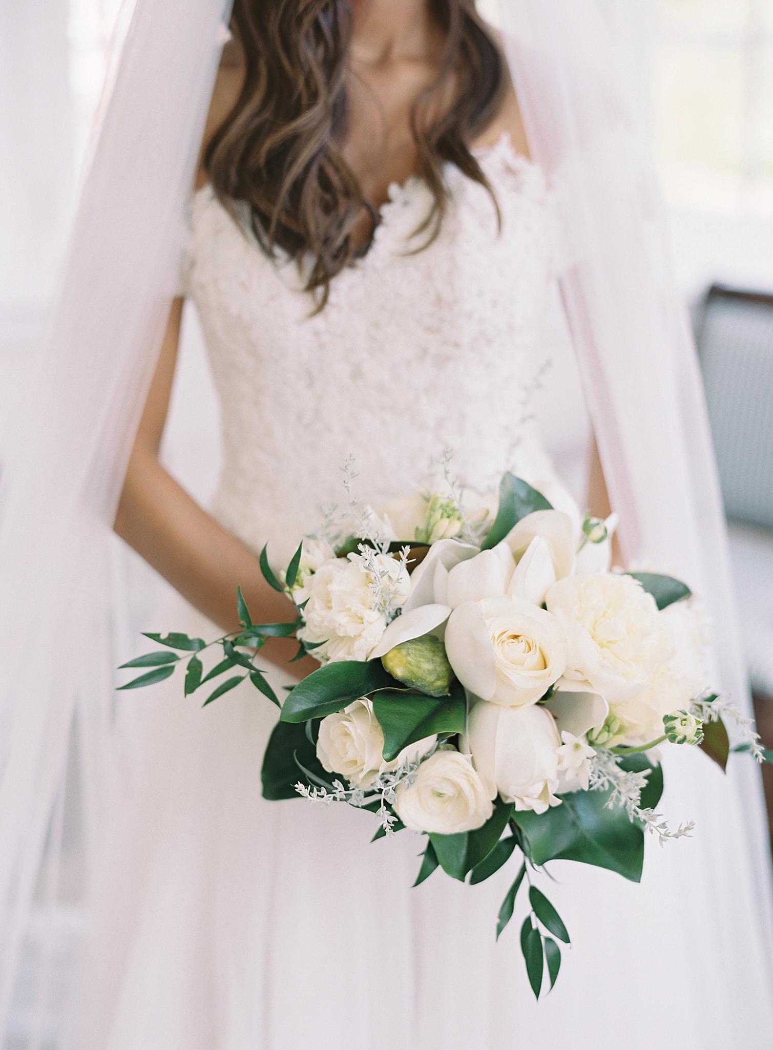 Close up of bride's white bouquet while getting ready for her Omni Homestead Resort wedding.