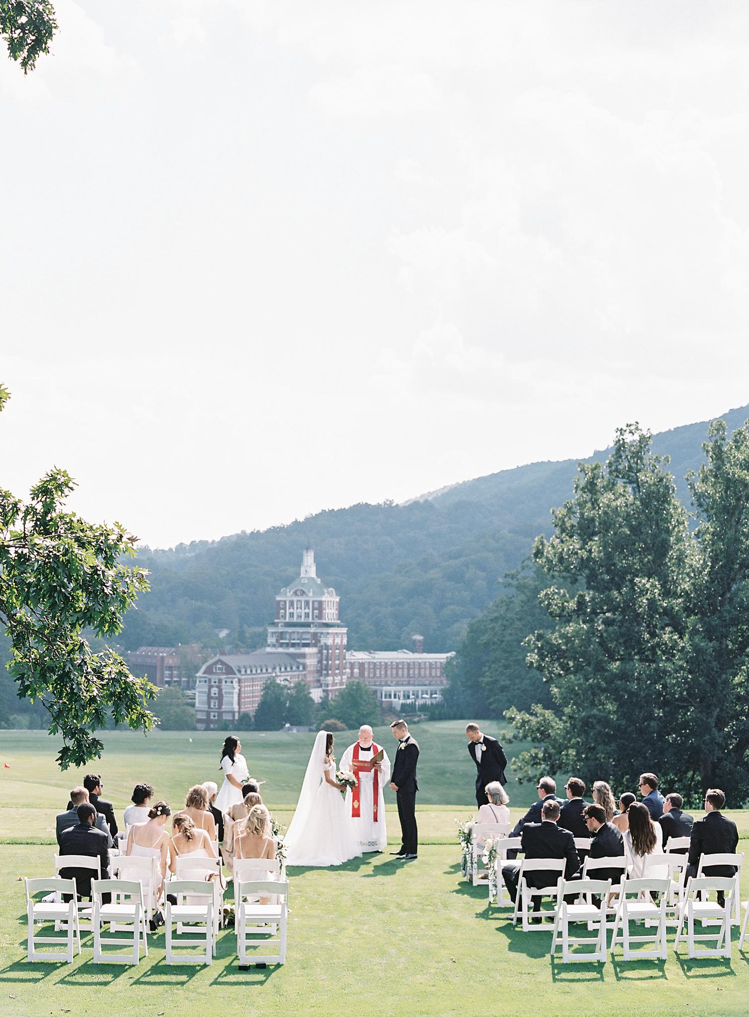 Wide shot of ceremony overlooking The Omni Homestead Resort.