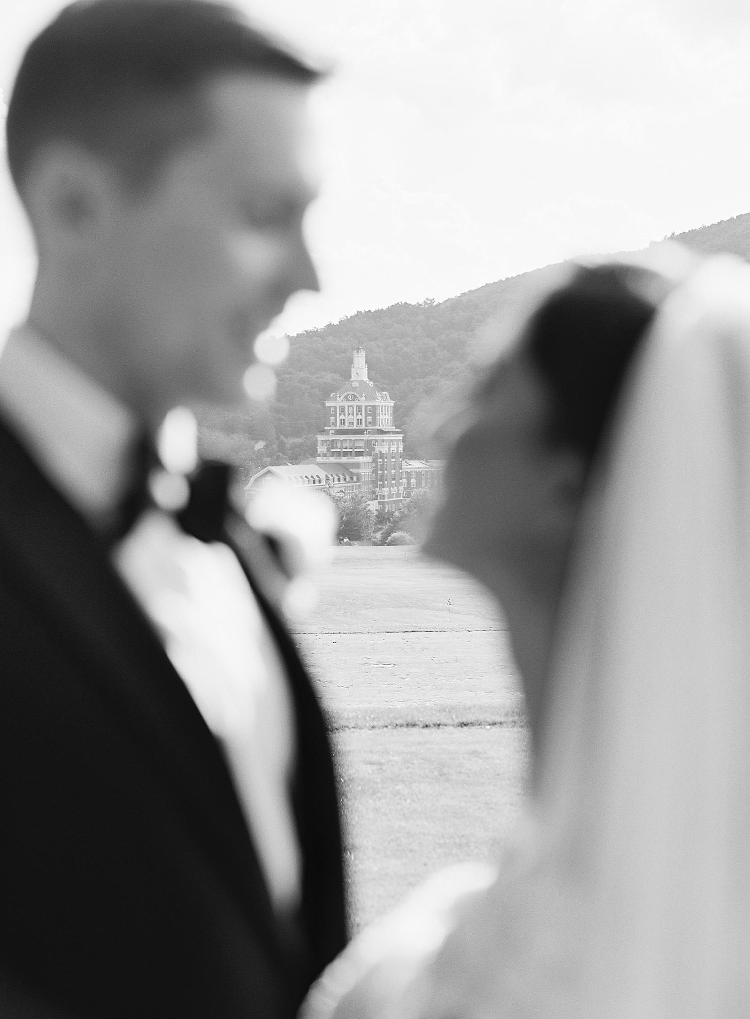 Bride and groom about to kiss with The Omni Homestead Resort wedding.