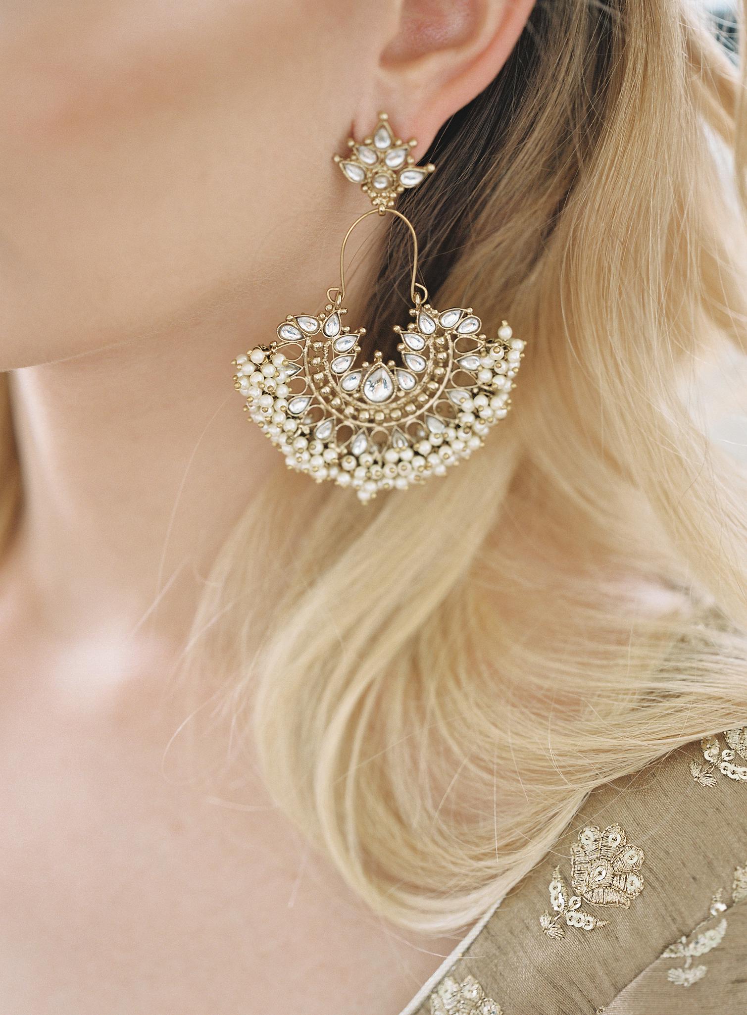 Close up shot of the bridesmaids Indian jewelry.