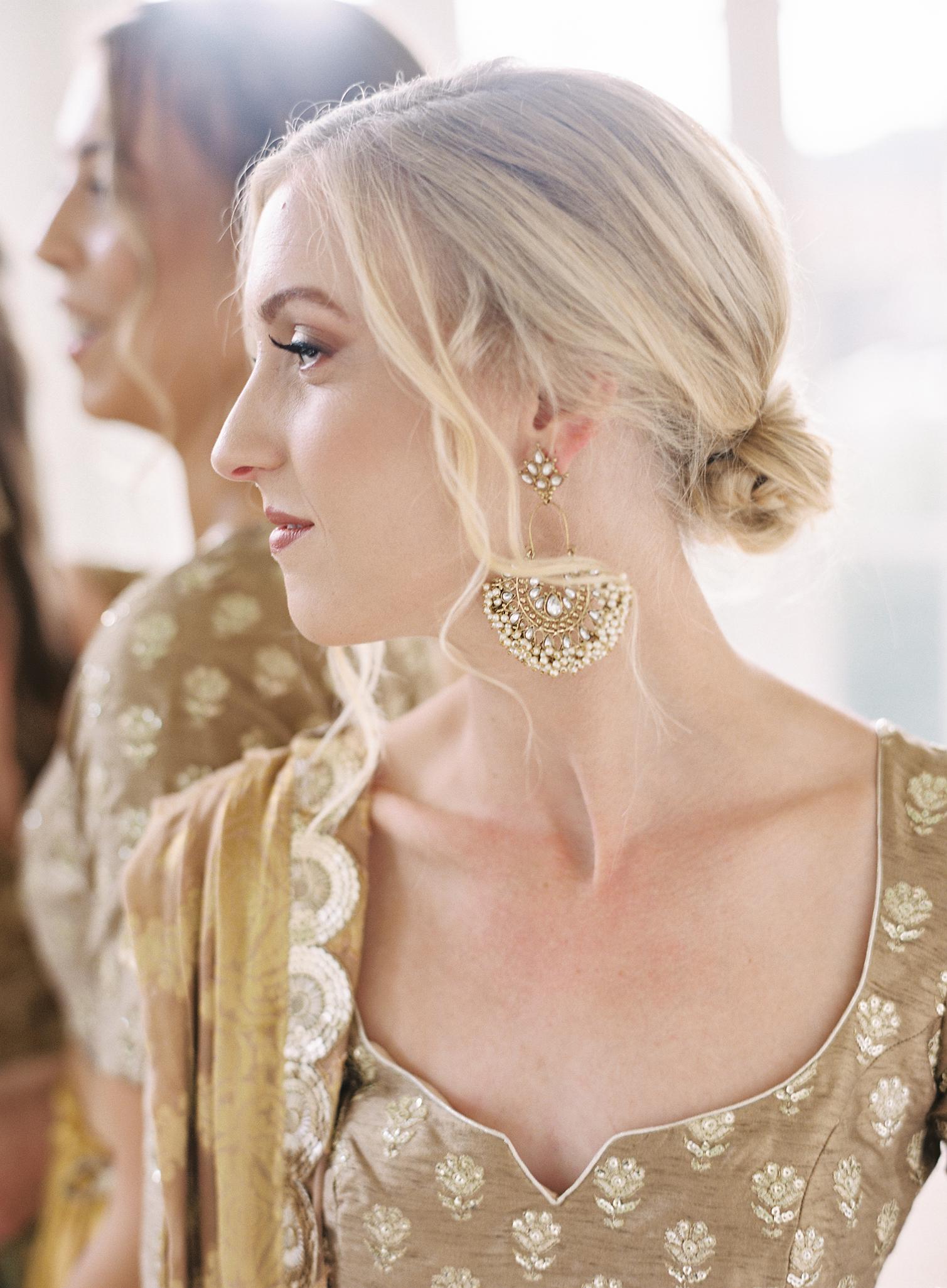 Close up shot of the bridesmaids Indian jewelry.