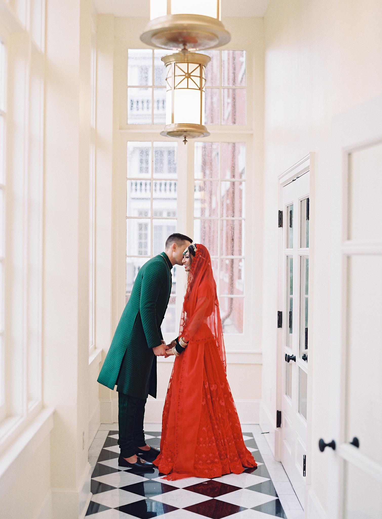 Bride and groom kissing just before their wedding reception at The Omni Homestead Resort.