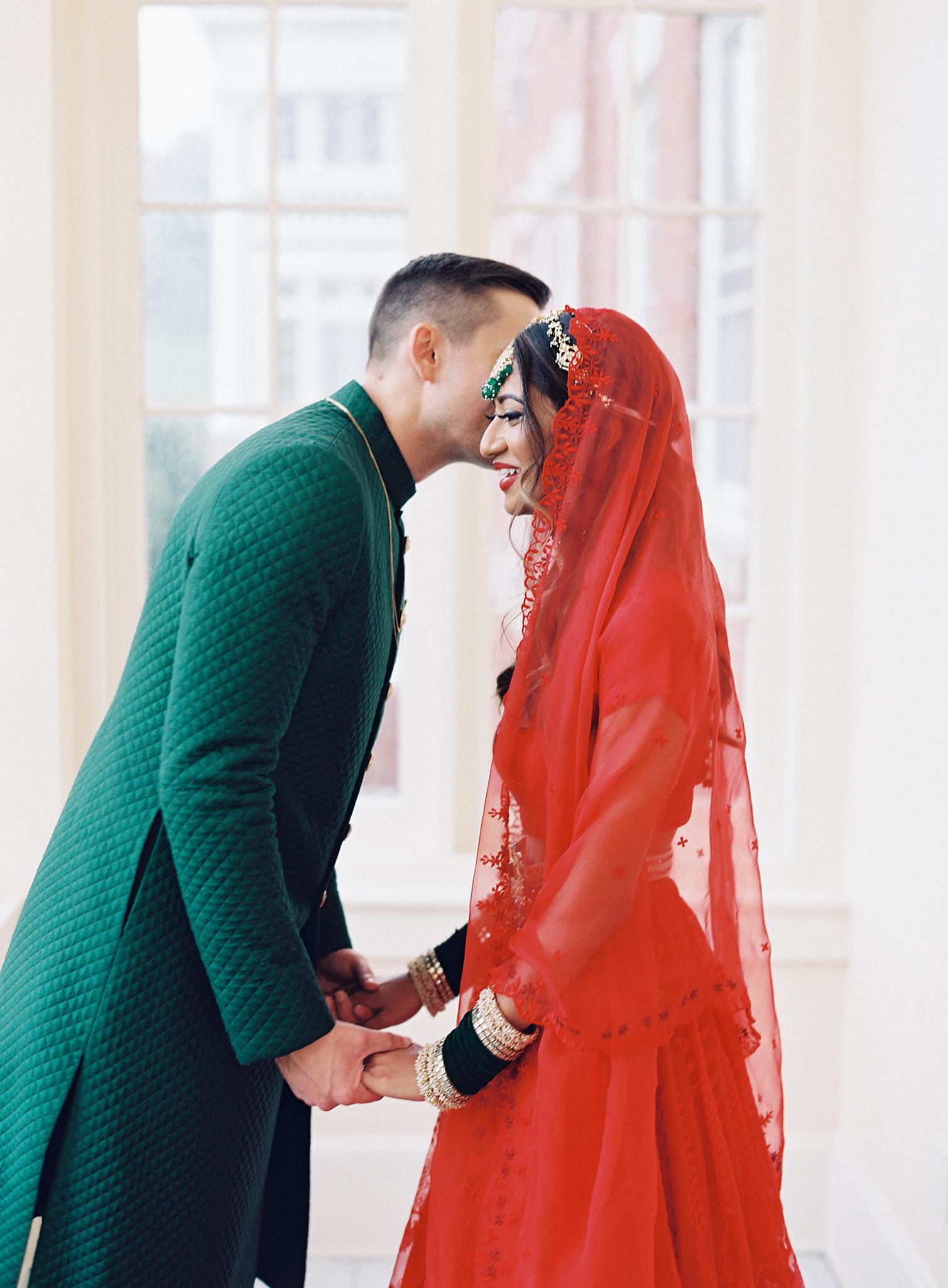 Bride and groom kissing just before their wedding reception at The Omni Homestead Resort.