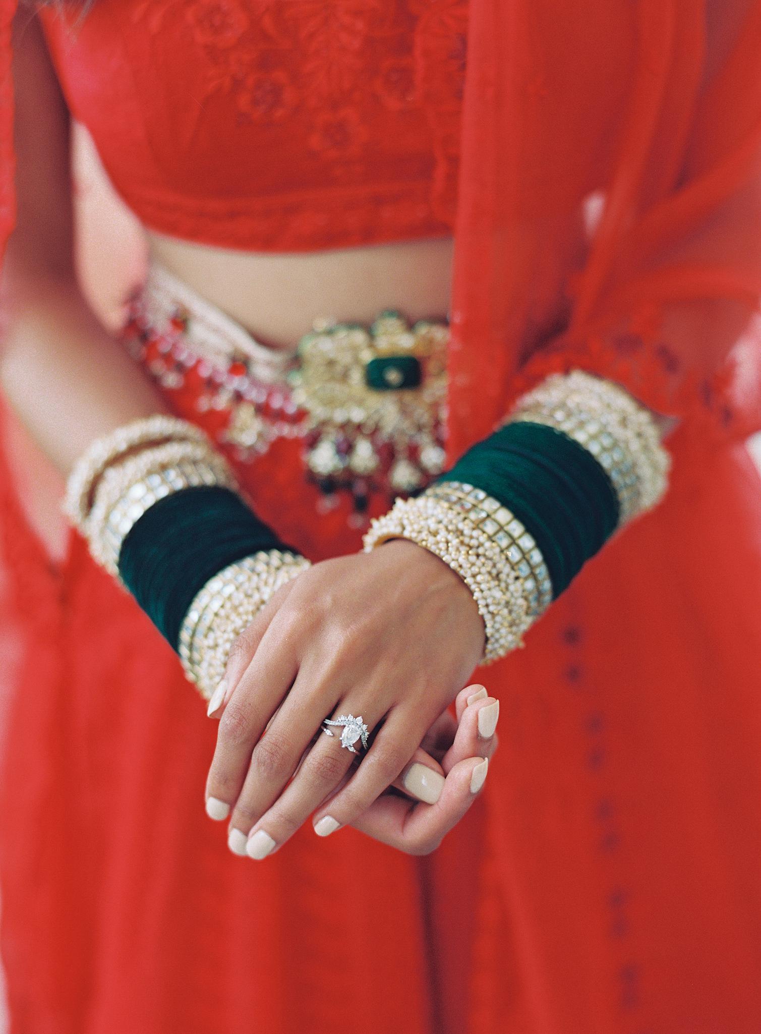 Bride showing off her Indian wedding jewelry just before here wedding reception at The Omni Homestead Resort.