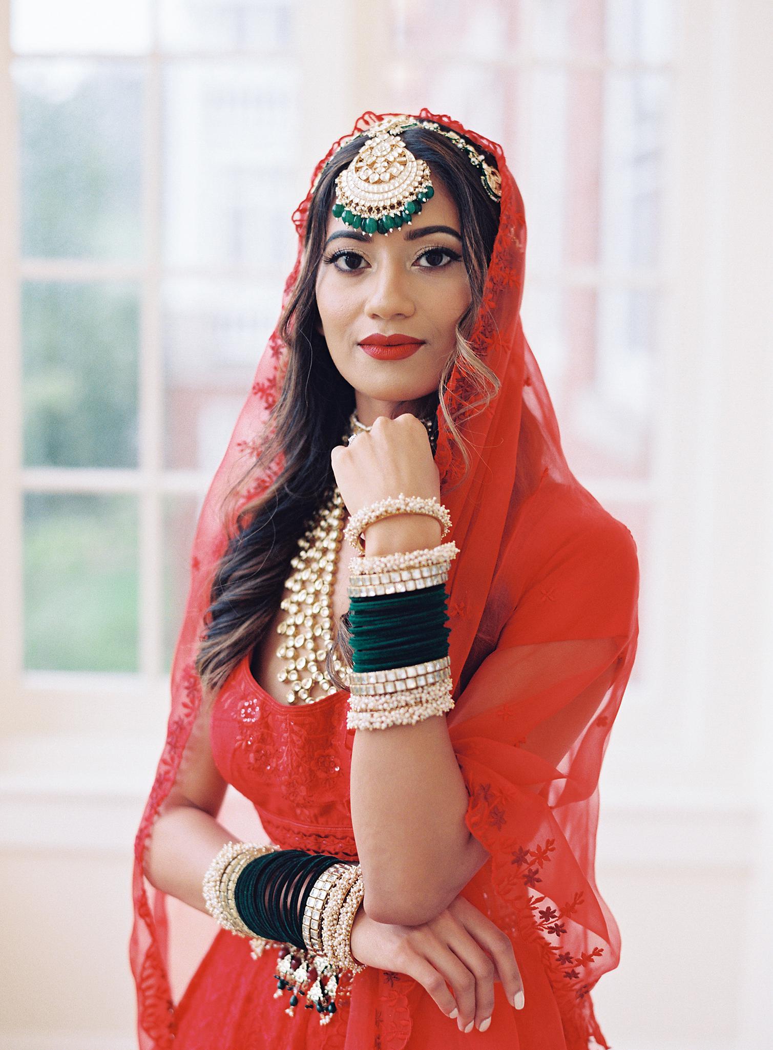 Bride showing off her Indian wedding jewelry just before here wedding reception at The Omni Homestead Resort.