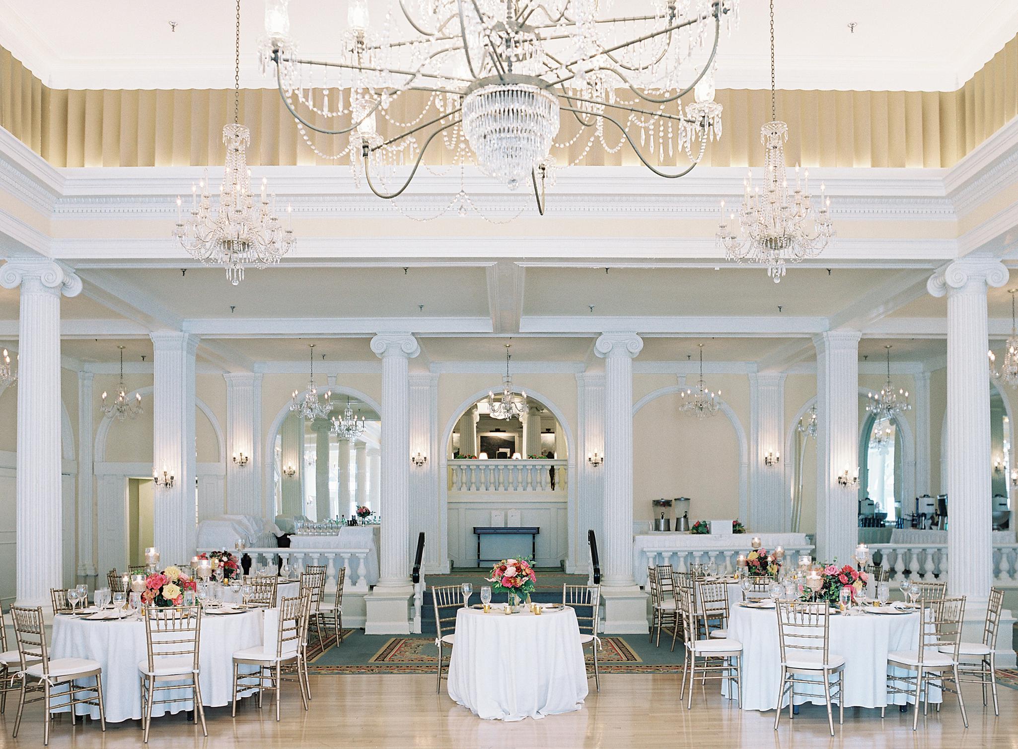 Wide shot of reception space in the crystal room at an Omni Homestead Resort wedding.