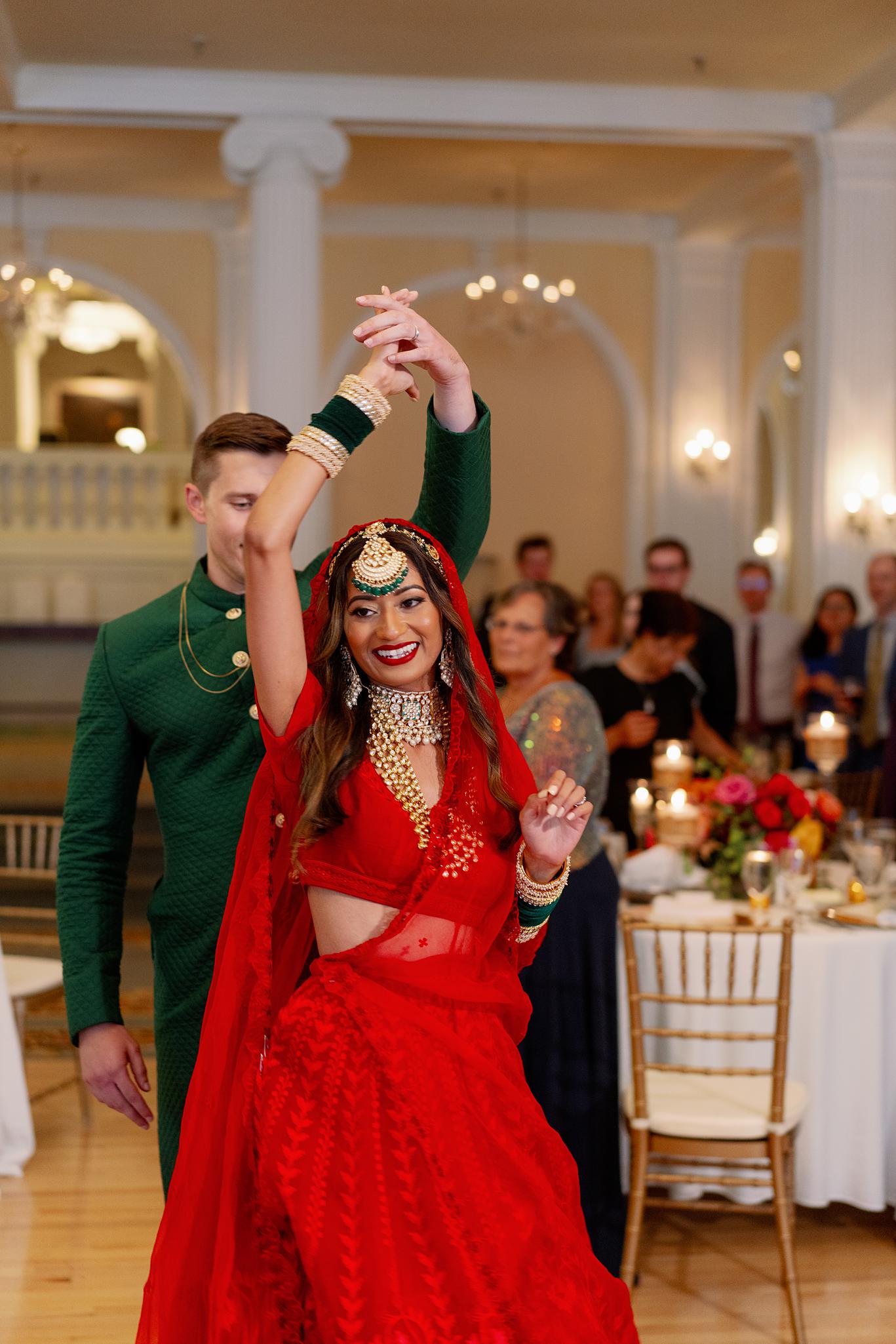 Bride and groom sharing their first dance in the crystal ball room at their Omni Homestead Resort wedding.