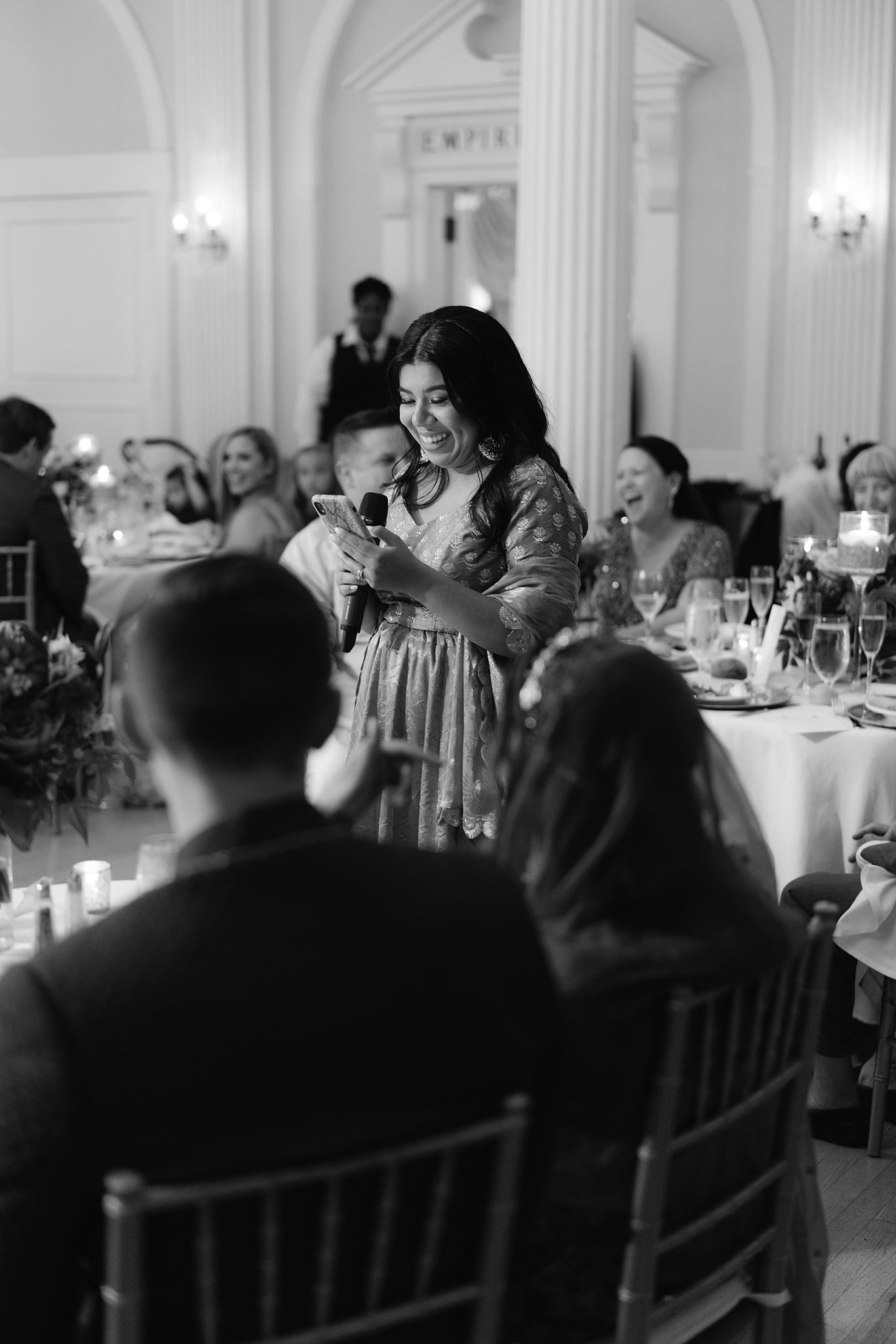 Maid of honor giving his toast to the bride and groom at an Omni Homestead Resort wedding.