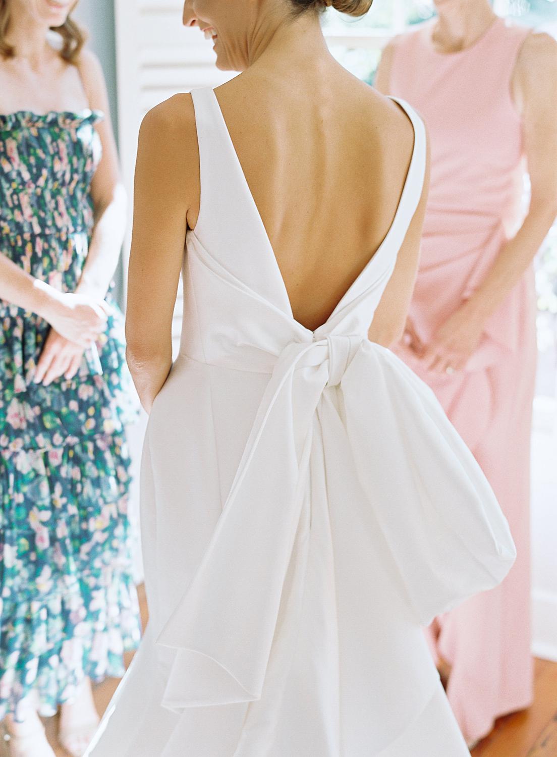 Detail shot of back of brides dress while she is getting ready for her William Paca House Wedding in Annapolis